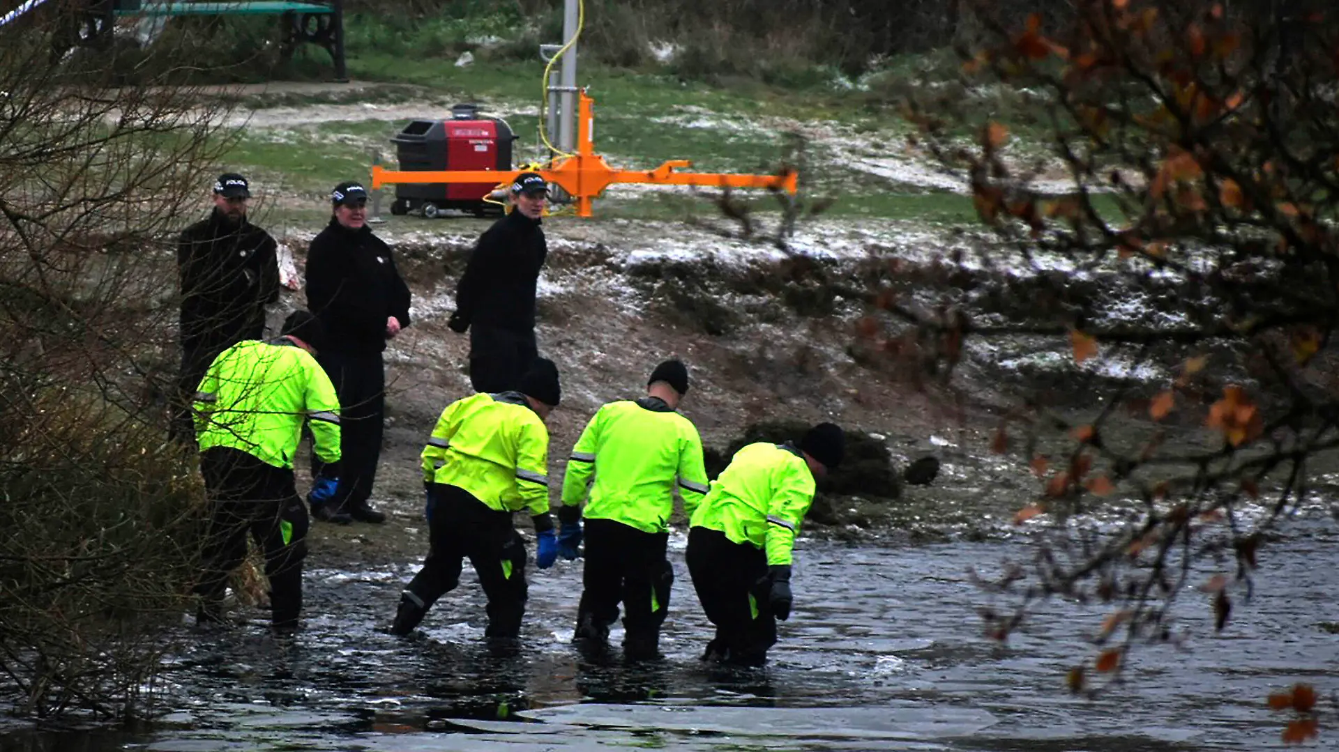 Police search teams at the scene after children fell through ice,in Babbs Mill Park in Kingshurst, Solihull, England, Monday, Dec. 12, 2022. Three young boys who fell through ice covering a lake in central England have died and a fourth remains hospitalized as weather forecasters issued severe weather warnings for large parts of the United Kingdom. Rescuers pulled the boys, aged 8, 10 and 11, from the icy waters Sunday afternoon and rushed them to the hospital in the West Midlands, about 100 miles (160 kilometers) north of London. But they could not be revived after suffering cardiac arrest. (Matthew Cooper/PA via AP)