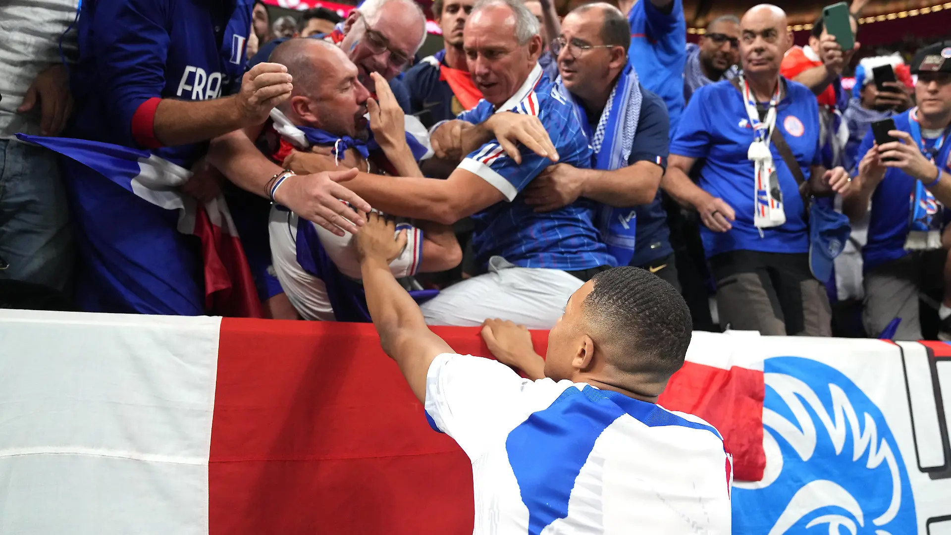  France v Morocco - FIFA World Cup, WM, Weltmeisterschaft, Fussball 2022 - Semi Final - Al Bayt Stadium France s Kylian Mbappe checks on a fan after being struck by a ball kicked by the player before the FIFA World Cup Semi-Final match at the Al Bayt Stadium in Al Khor, Qatar. Picture date: Wednesday December 14, 2022. Use subject to restrictions. Editorial use only, no commercial use without prior consent from rights holder. PUBLICATIONxNOTxINxUKxIRL Copyright: xAdamxDavyx 70249976