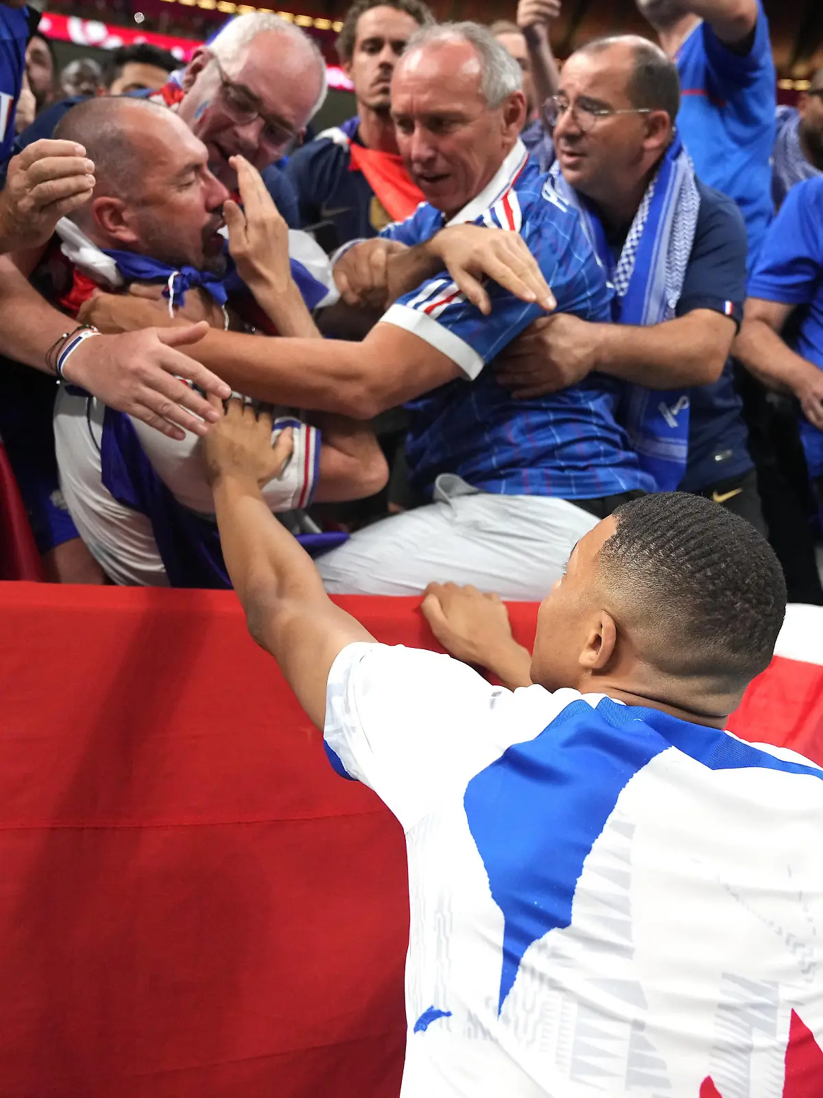  France v Morocco - FIFA World Cup, WM, Weltmeisterschaft, Fussball 2022 - Semi Final - Al Bayt Stadium France s Kylian Mbappe checks on a fan after being struck by a ball kicked by the player before the FIFA World Cup Semi-Final match at the Al Bayt Stadium in Al Khor, Qatar. Picture date: Wednesday December 14, 2022. Use subject to restrictions. Editorial use only, no commercial use without prior consent from rights holder. PUBLICATIONxNOTxINxUKxIRL Copyright: xAdamxDavyx 70249976