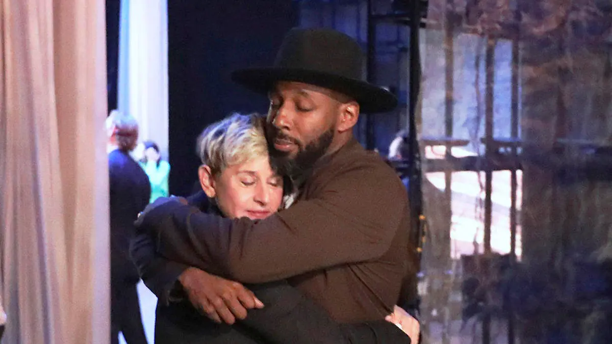 FILE - In this photo released by Warner Bros., talk show host Ellen DeGeneres embraces Stephen "tWitch" Boss during a taping of "The Ellen DeGeneres Show" at the Warner Bros. lot in Burbank, Calif. Boss, a longtime DJ and co-executive producer on the talk show “The Ellen DeGeneres Show” and former contestant on the dance competition show, “So You Can Think You Can Dance” has died at the age of 40. (Photo by Michael Rozman/Warner Bros., File)