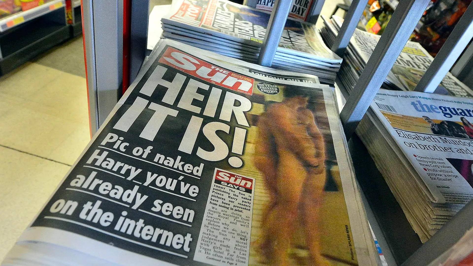 A copy of The Sun newspaper featuring a picture of a naked Prince Harry is seen in a shop in London August 24, 2012. The Sun tabloid on Friday published photographs of Prince Harry naked in Las Vegas, becoming the first British publication to defy a request from the royal family's lawyers. REUTERS/Toby Melville (BRITAIN - Tags: SOCIETY ROYALS ENTERTAINMENT MEDIA)