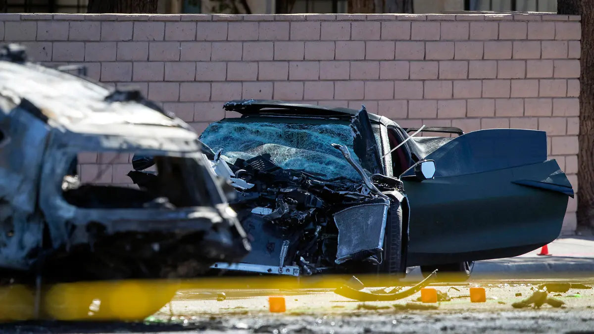 FILE - A Chevrolet Corvette is shown at the scene of a fatal crash on South Rainbow Boulevard between Tropicana Avenue and Flamingo Road in Las Vegas, Tuesday, Nov. 2, 2021. Former Las Vegas Raiders player Henry Ruggs was sentenced Wednesday, Aug. 9, 2023, in Las Vegas, to at least three years in a Nevada prison for killing a woman in a fiery crash while driving his sports car drunk at speeds up to 156 mph on a city street nearly two years ago. (Steve Marcus/Las Vegas Sun via AP, File)