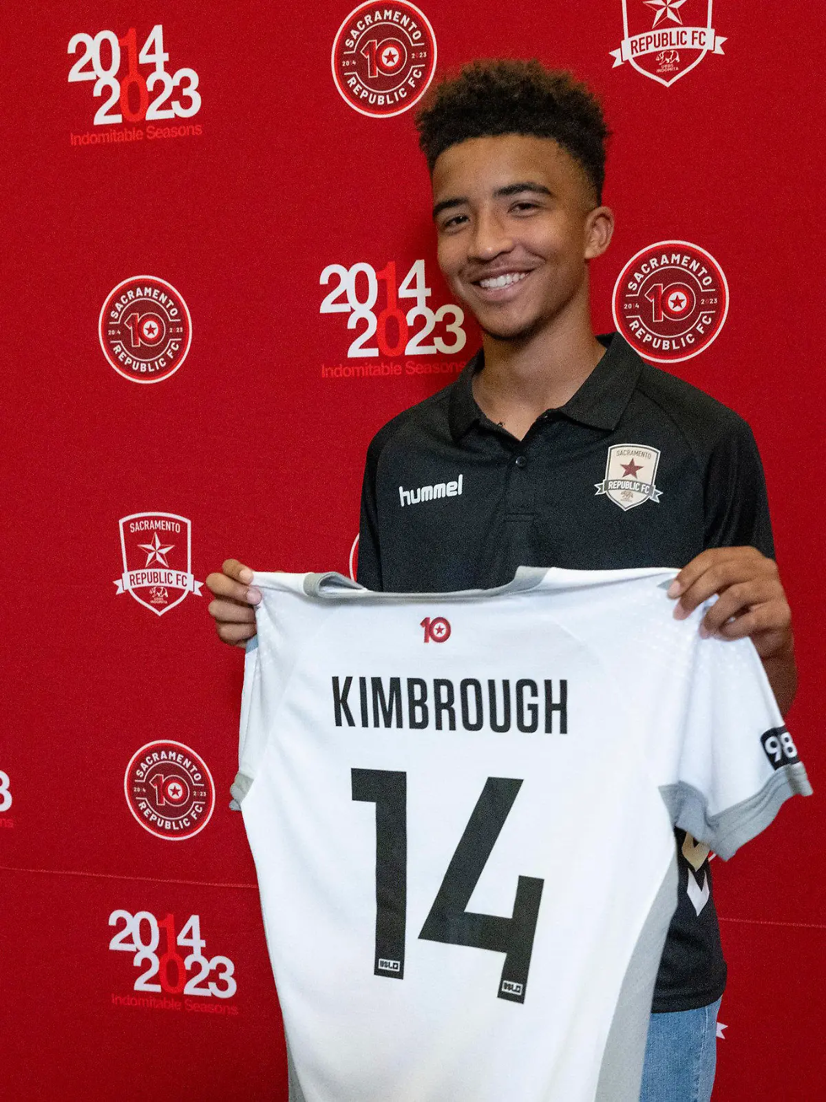 Da'vian Kimbrough, 13, holds up his jersey after signing contract with the Sacramento Republic of the second-tier League Championship of the United Soccer League, Tuesday, Aug. 8, 2023,  in Sacramento, Calif. (Paul Kitagaki Jr./The Sacramento Bee via AP)