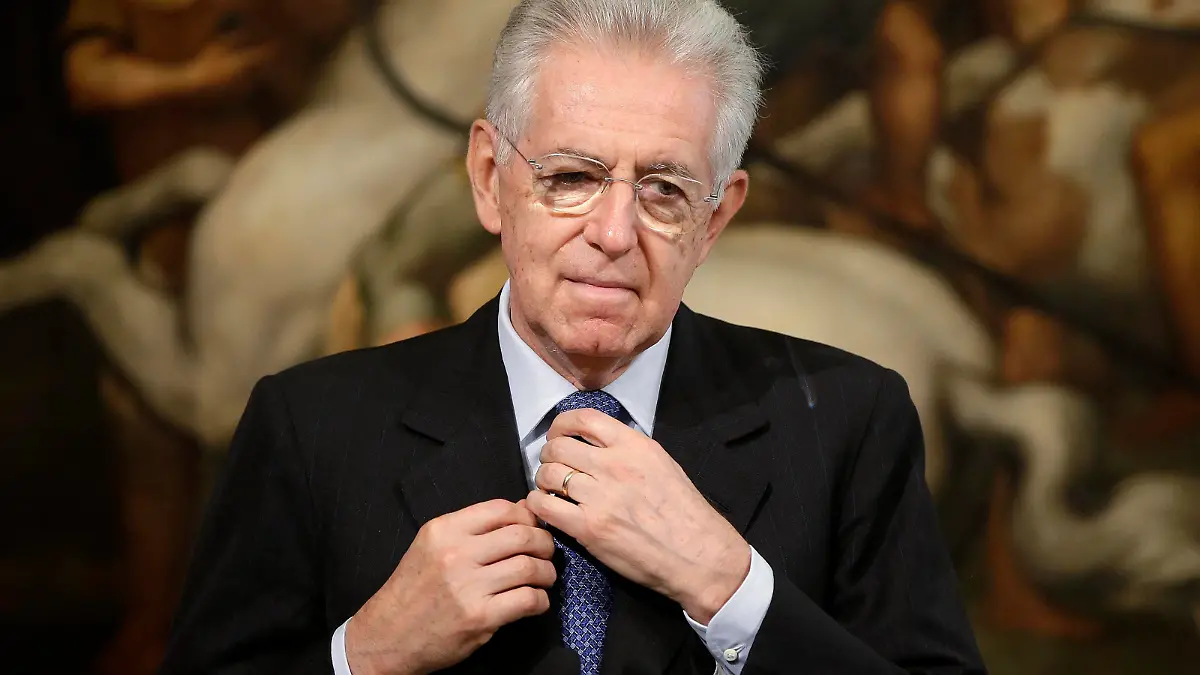 Italy's Prime Minister Mario Monti adjusts his tie during a joint news conference with Austria's Chancellor Werner Faymann at Chigi Palace in Rome, in this October 24, 2012 file picture. Monti on December 21, 2012 resigned as Italy's Prime Minister, opening the way to elections expected in February. REUTERS/Tony Gentile/Files (ITALY - Tags: POLITICS)