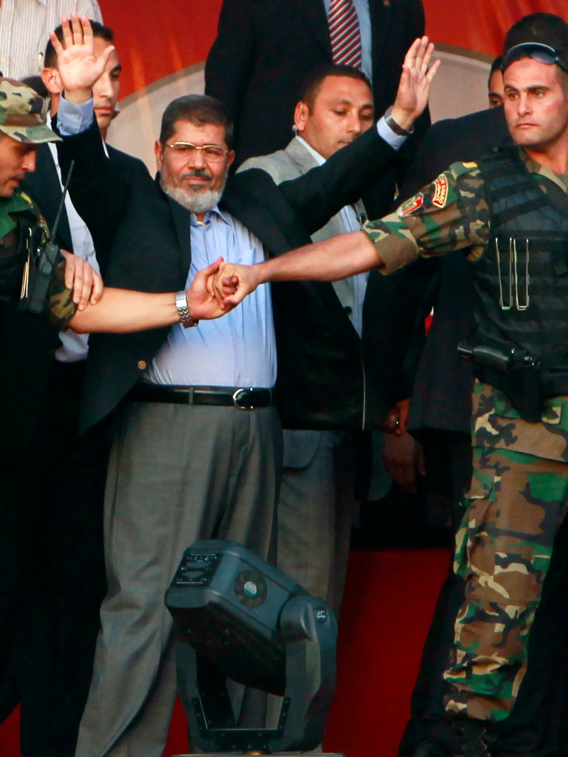 RNPS IMAGES OF THE YEAR 2012 - Egypt's Islamist President-elect Mohamed Mursi waves to his supporters while surrounded by his members of the presidential guard in Cairo's Tahrir Square, June 29, 2012. Mursi took an informal oath of office on Friday before tens of thousands of supporters in Cairo's Tahrir Square, in a slap at the generals trying to limit his power. REUTERS/Amr Abdallah Dalsh (EGYPT - Tags: POLITICS CIVIL UNREST TPX IMAGES OF THE DAY)