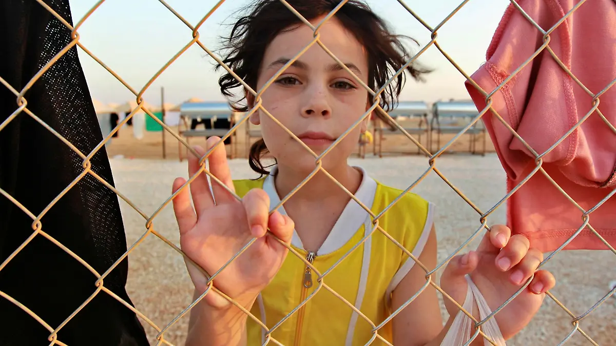 RNPS IMAGES OF THE YEAR 2012 - A Syrian refugee is pictured at the Al Zaatri refugee camp in the Jordanian city of Mafraq, near the border with Syria, July 31, 2012. Jordan opened the camp with 2,000 tents on Sunday, to accommodate an expected new influx of refugees near the border. Diplomats say around 115,000 Syrians have fled their country, mostly to Turkey, Lebanon and Jordan, to escape the 17-month rebellion against President Bashar al-Assad. The Jordanian authorities say around 130,000 Syrians have come to Jordan since the uprising began, but diplomats say not all of them are classified as refugees. REUTERS/Muhammad Hamed (JORDAN - Tags: POLITICS CONFLICT SOCIETY)