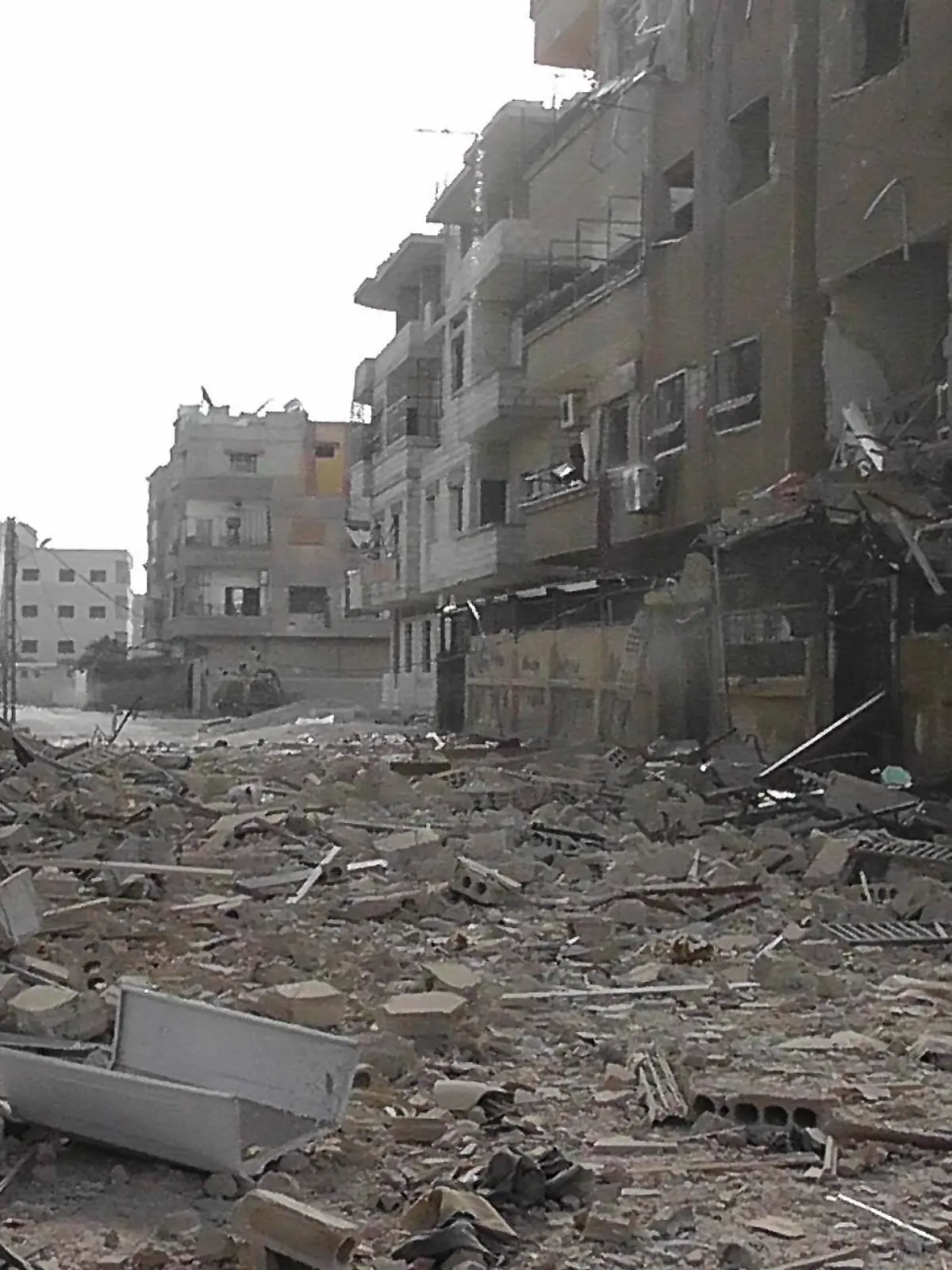 A view of buildings damaged by what activists said were missiles fired by a Syrian Air Force fighter jet loyal to Syria's President Bashar al-Assad in Daria, near Damascus, November 30, 2012. REUTERS/Kenan Al-Derani/Shaam News Network/Handout (SYRIA - Tags: CIVIL UNREST MILITARY POLITICS CONFLICT) FOR EDITORIAL USE ONLY. NOT FOR SALE FOR MARKETING OR ADVERTISING CAMPAIGNS. THIS IMAGE HAS BEEN SUPPLIED BY A THIRD PARTY. IT IS DISTRIBUTED, EXACTLY AS RECEIVED BY REUTERS, AS A SERVICE TO CLIENTS