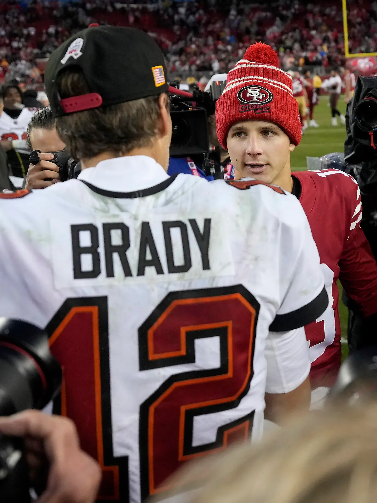 Tampa Bay Buccaneers quarterback Tom Brady (12) greets San Francisco 49ers quarterback Brock Purdy after an NFL football game in Santa Clara, Calif., Sunday, Dec. 11, 2022. (AP Photo/Tony Avelar)