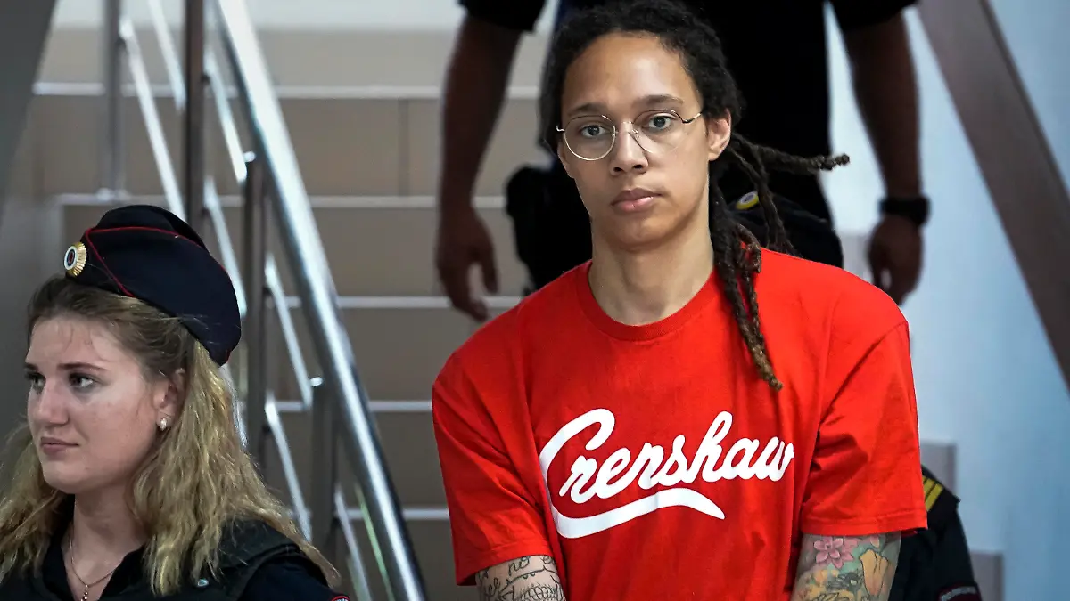 WNBA star and two-time Olympic gold medalist Brittney Griner is escorted to a courtroom for a hearing, in Khimki just outside Moscow, Russia, Thursday, July 7, 2022. Griner pleaded guilty Thursday to drug possession charges on the second day of her trial in a Russian court in a case that could see her sentenced to up to 10 years in prison. (AP Photo/Alexander Zemlianichenko)