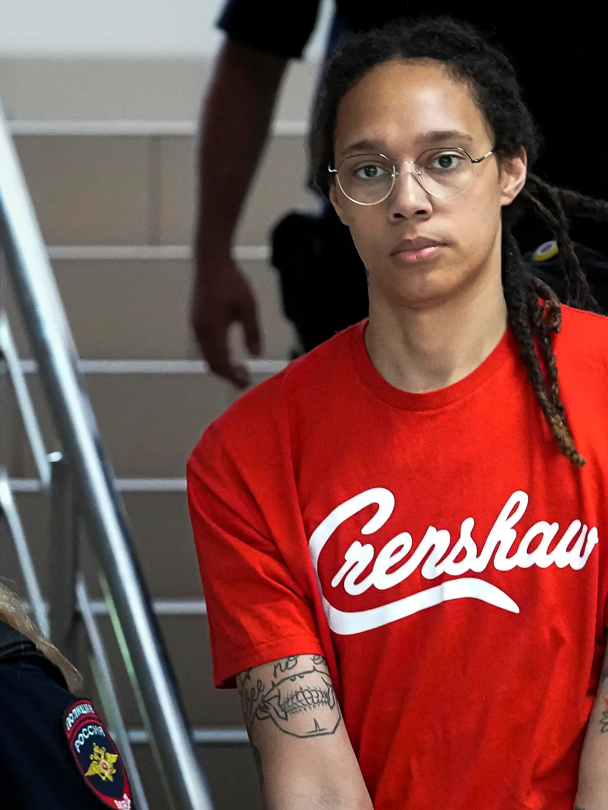 WNBA star and two-time Olympic gold medalist Brittney Griner is escorted to a courtroom for a hearing, in Khimki just outside Moscow, Russia, Thursday, July 7, 2022. Griner pleaded guilty Thursday to drug possession charges on the second day of her trial in a Russian court in a case that could see her sentenced to up to 10 years in prison. (AP Photo/Alexander Zemlianichenko)
