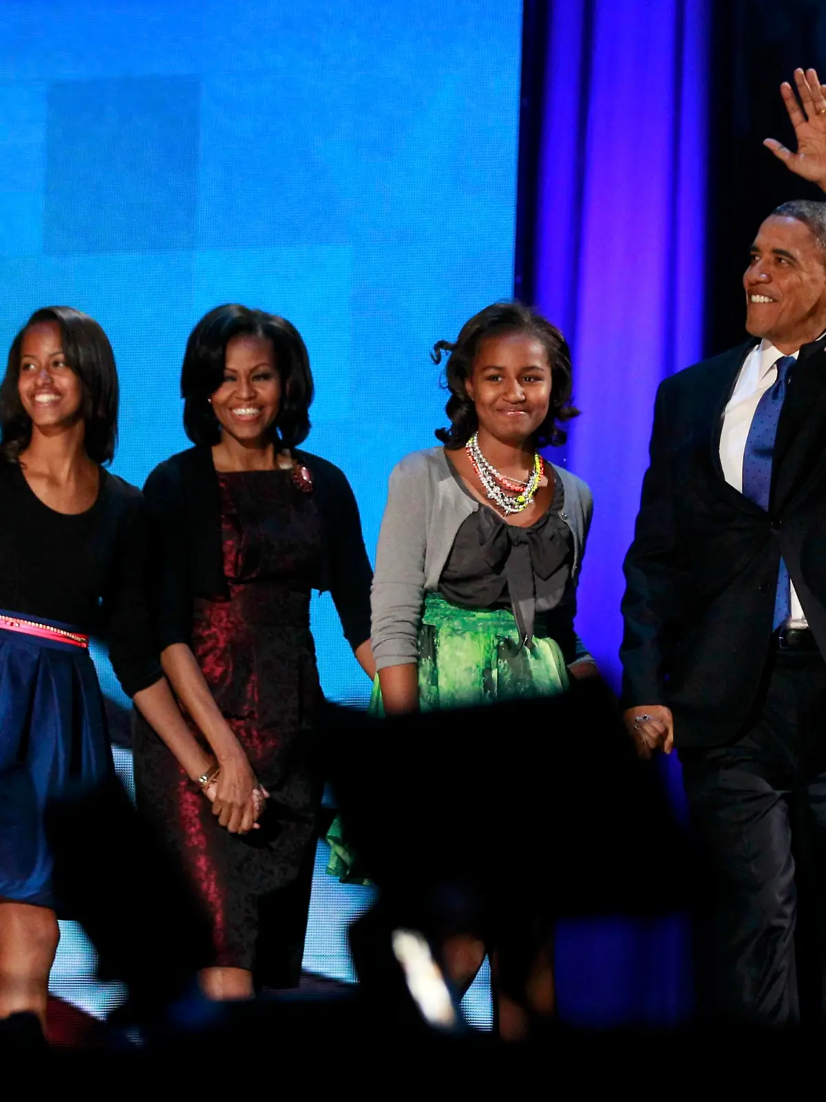 U.S. President Barack Obama greets supporters on stage with first lady Michelle Obama and daughters Malia (L) and Sasha during his election night rally in Chicago, November 7, 2012. REUTERS/Jason Reed (UNITED STATES  - Tags: POLITICS ELECTIONS USA PRESIDENTIAL ELECTION)  