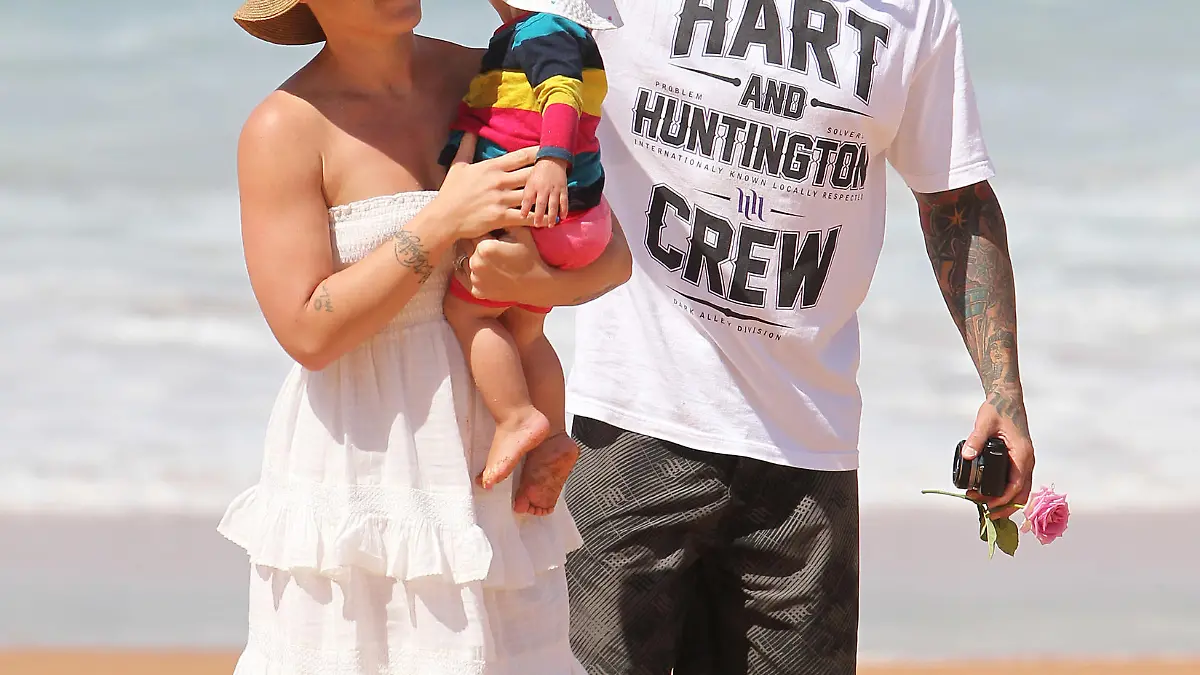 Pink and family enjoy a sunny day at the beach in Sydney.