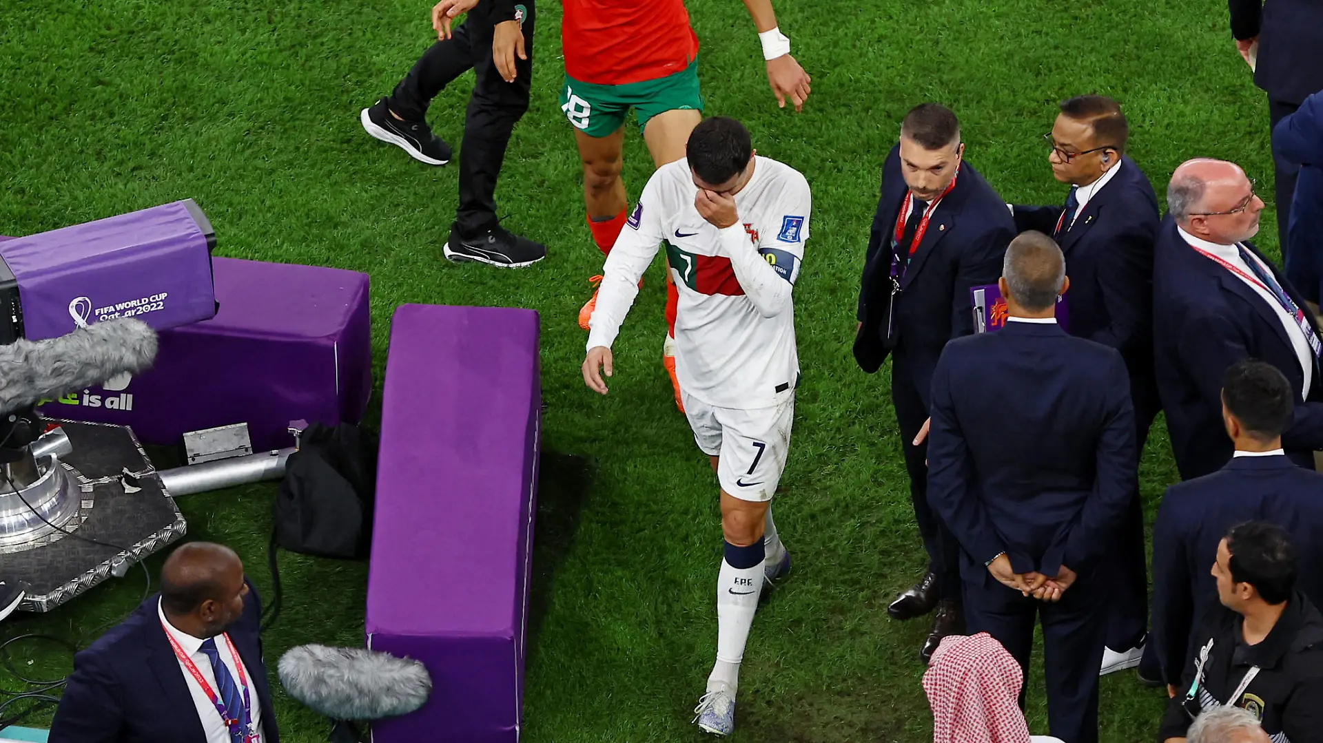 Soccer Football - FIFA World Cup Qatar 2022 - Quarter Final - Morocco v Portugal - Al Thumama Stadium, Doha, Qatar - December 10, 2022 Morocco's Jawad El Yamiq and Portugal's Cristiano Ronaldo after Morocco progress to the semi finals and Portugal are eliminated from the World Cup REUTERS/Paul Childs