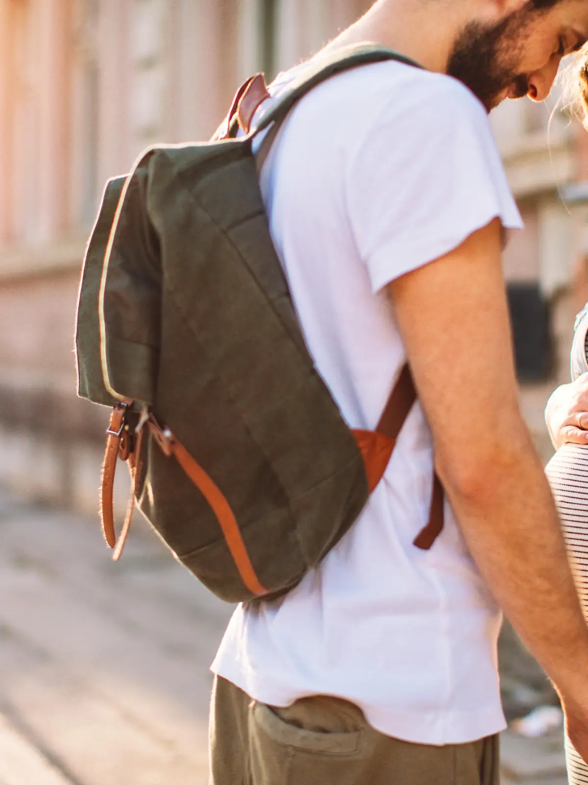 Photo of a young couple, soon to become parents, enjoy in a beautiful sunny day