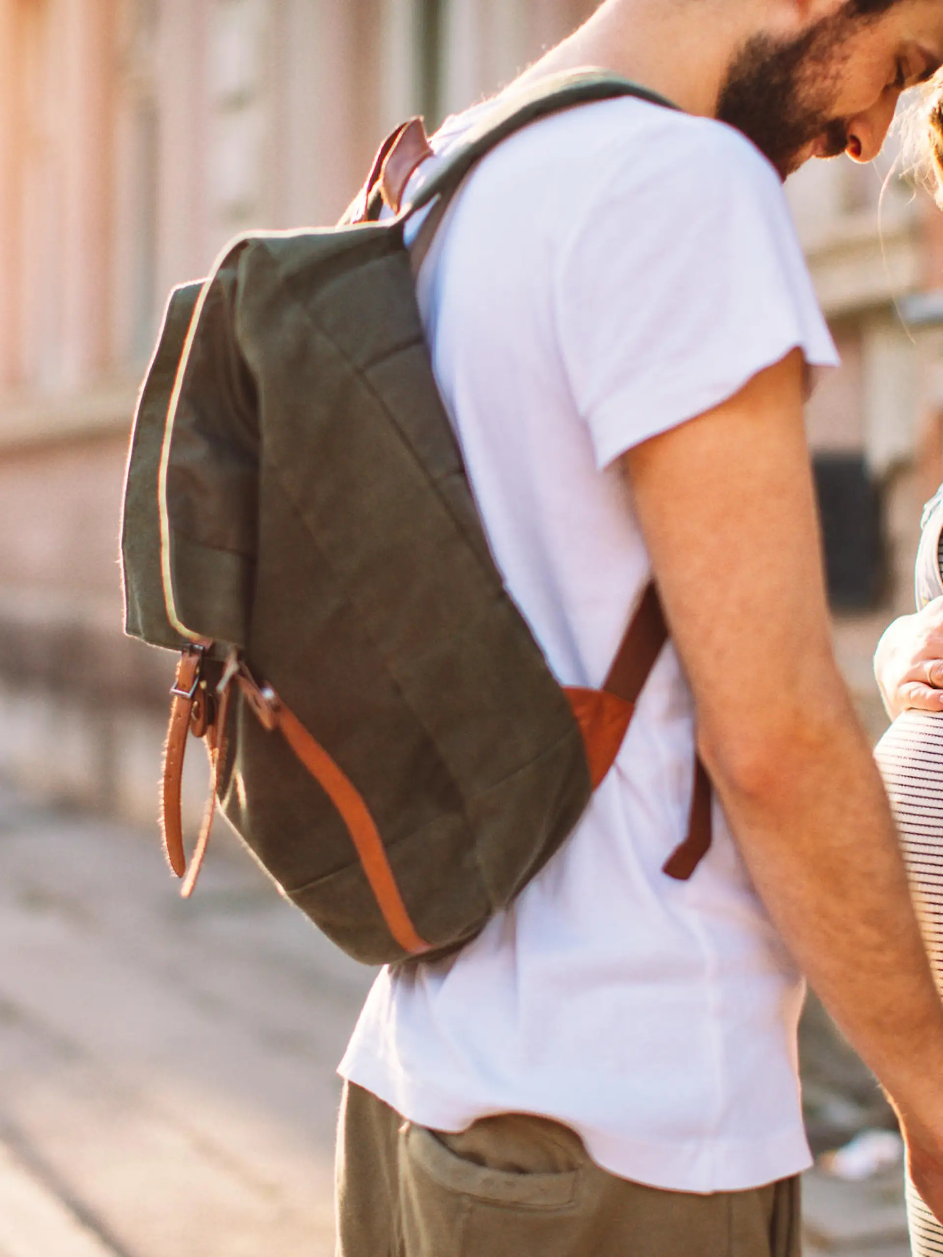 Photo of a young couple, soon to become parents, enjoy in a beautiful sunny day