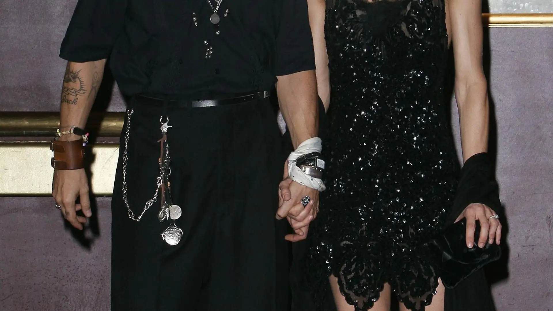 PARIS - JULY 6: Actor Johnny Depp and partner Vanessa Paradis attend the French premiere of "Pirates of the Caribbean 2: Dead Man's Chest" at the Gaumont Marignan Cinema July 6, 2006 in Paris, France. (Photo by Francois Durand/Getty Images)