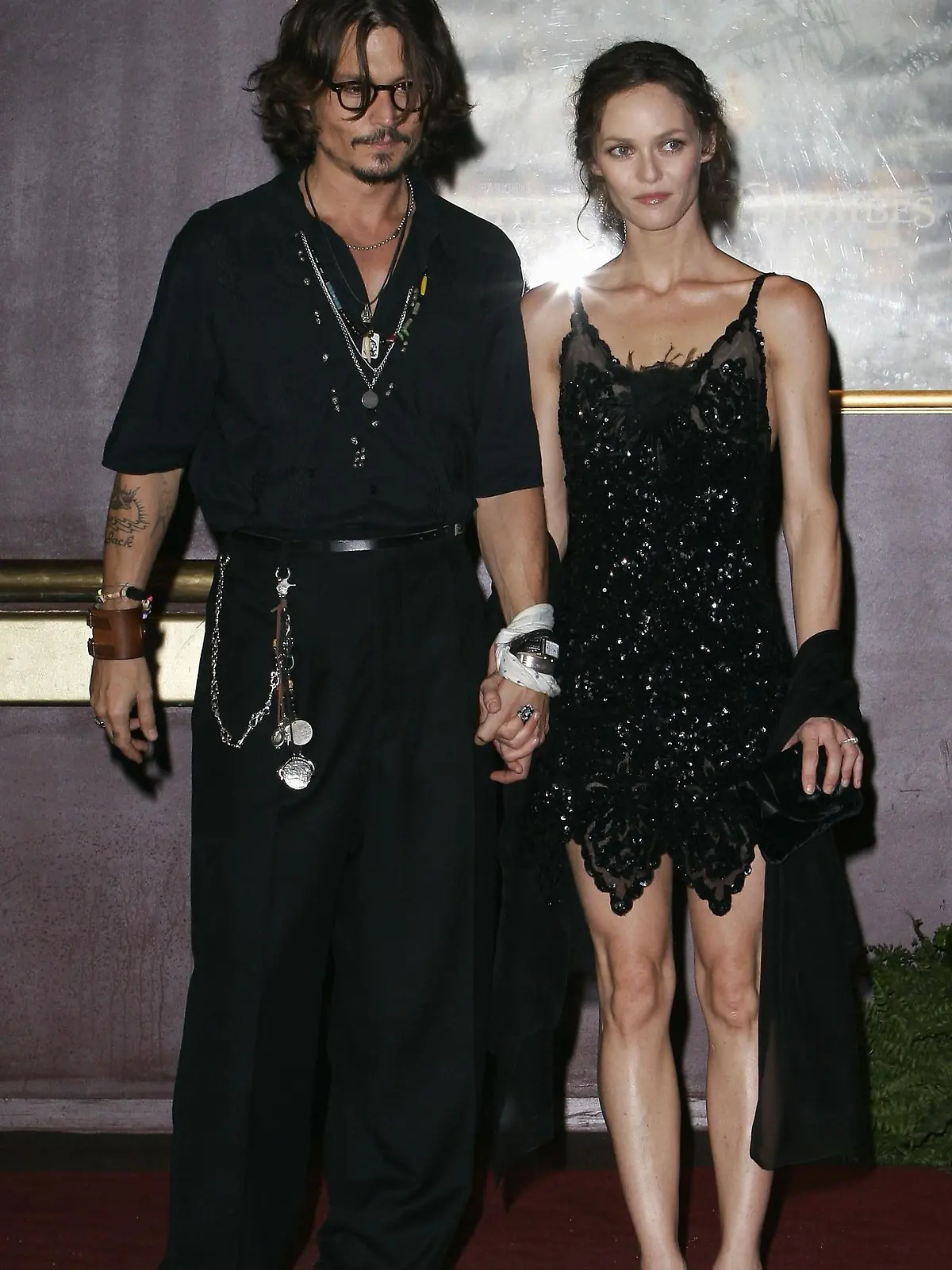 PARIS - JULY 6:  Actor Johnny Depp and partner Vanessa Paradis attend the French premiere of "Pirates of the Caribbean 2: Dead Man's Chest" at the Gaumont Marignan Cinema July 6, 2006 in Paris, France.  (Photo by Francois Durand/Getty Images)