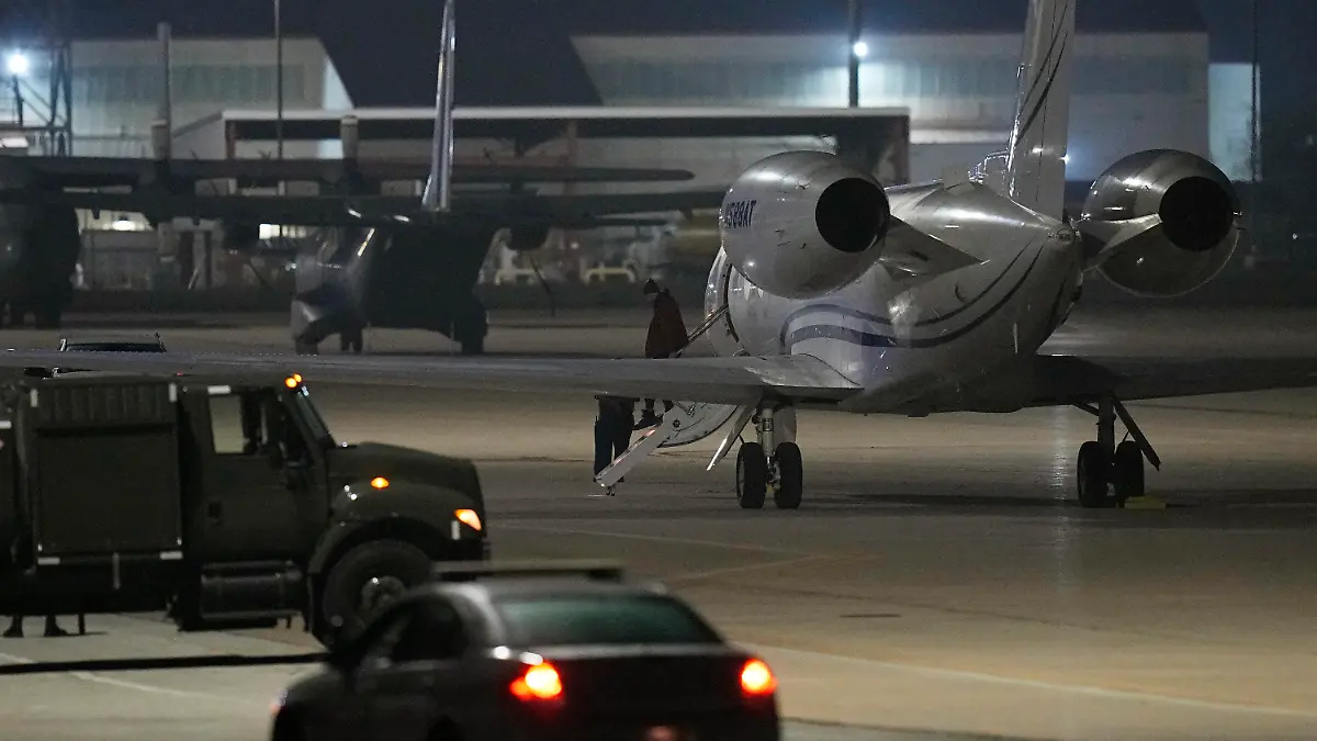 WNBA star Brittney Griner deplanes at Kelly Field in San Antonio, Texas, following her release in a prisoner swap with Russia, Friday, Dec. 9, 2022. (AP Photo/Eric Gay)