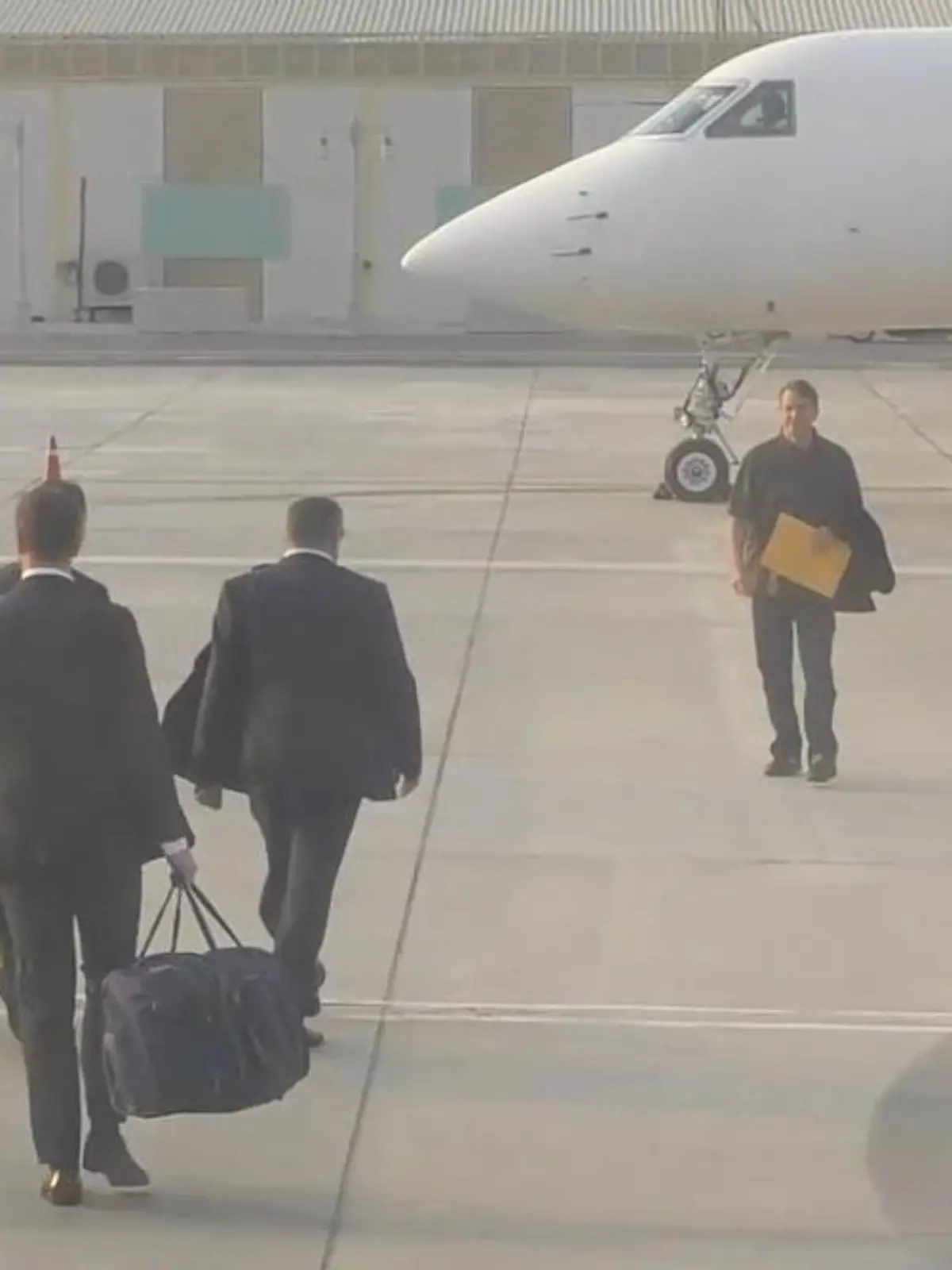 UNITED ARAB EMIRATES, ABU DHABI - DECEMBER 8, 2022: Russian citizen Viktor Bout (2nd R) is seen ahead of departing for Russia. Viktor Bout, sentenced to 25 years in prison for conspiring to kill US citizens and officials, was freed from a US prison in a prisoner exchange for US basketball player Brittney Griner, sentenced to 9 years in a Russian penal colony for drug smuggling. Video grab. Best quality available. FSB/TASS / action press