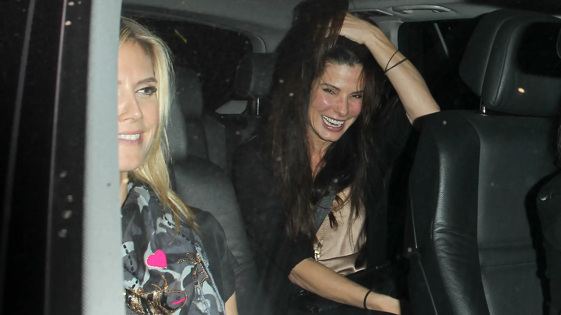 Friends Heidi Klum and Sandra Bullock step out for a dinner full of laughs at Mr Chow restaurant.