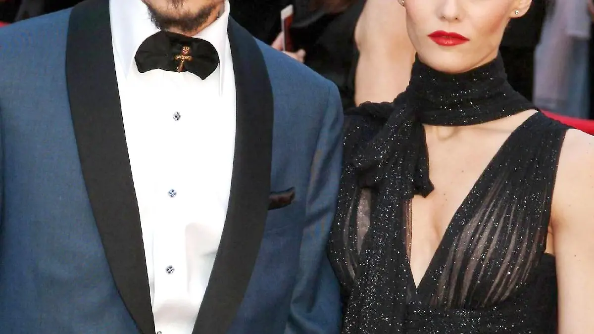 JOHNNY DEPP's seven-year-old daughter LILY-ROSE is seriously ill in an English hospital, according to British newspaper Daily Mirror. The PIRATES OF THE CARIBBEAN actor, 43, and his partner VANESSA PARADIS, 34, are holding a vigil at the child's bedside after she was struck down by the undisclosed illness nine days ago. The Mirror claims it knows what medical condition Lily-Rose is suffering from, but have decided to withhold it from the press out of respect for the privacy of Depp's family. Depp had been filming SWEENEY TODD in London and Buckinghamshire when his daughter was rushed to hospital last week (ends02MAR07). A hospital source says, "He has not asked for any special favours but just wants the best for his child, like any parent. "It is such a difficult time for him but he is hanging in there for the sake of his daughter and the whole family is just praying that she gets better. They are taking each day as it comes. "It's been an emotional rollercoaster for all of them and he's been worrying himself silly. He's a devoted dad and is spending as much time as he can with Lily." Depp and French model/actress Paradis also have a four-year-old son JACK. (ES/WNTMI)London, England - 08.03.07JOHNNY DEPP and VANESSA PARADISRed carpet arrivals The 2005 Academy Awards (Oscars) held at The Kodak TheatreHollywood, California - 27.02.05Credit:Jody Cortes/WENN