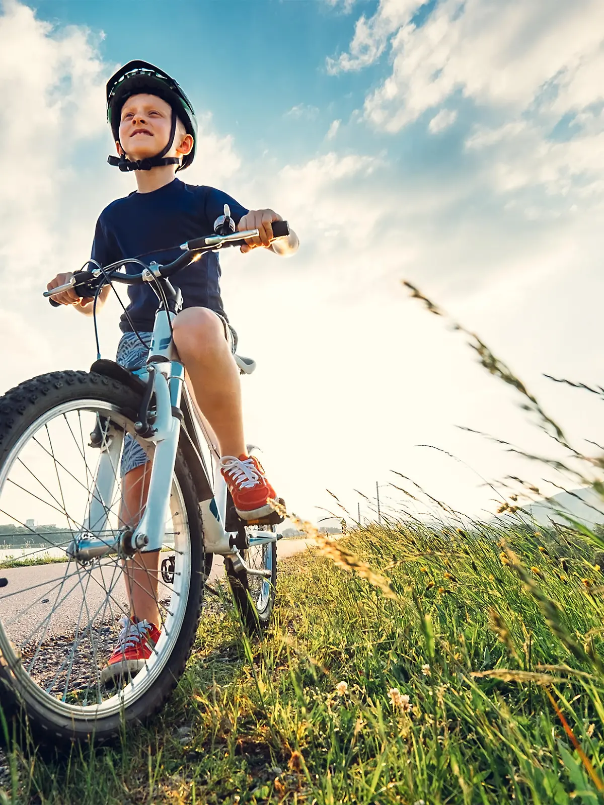 Boy start to ride a bicycle