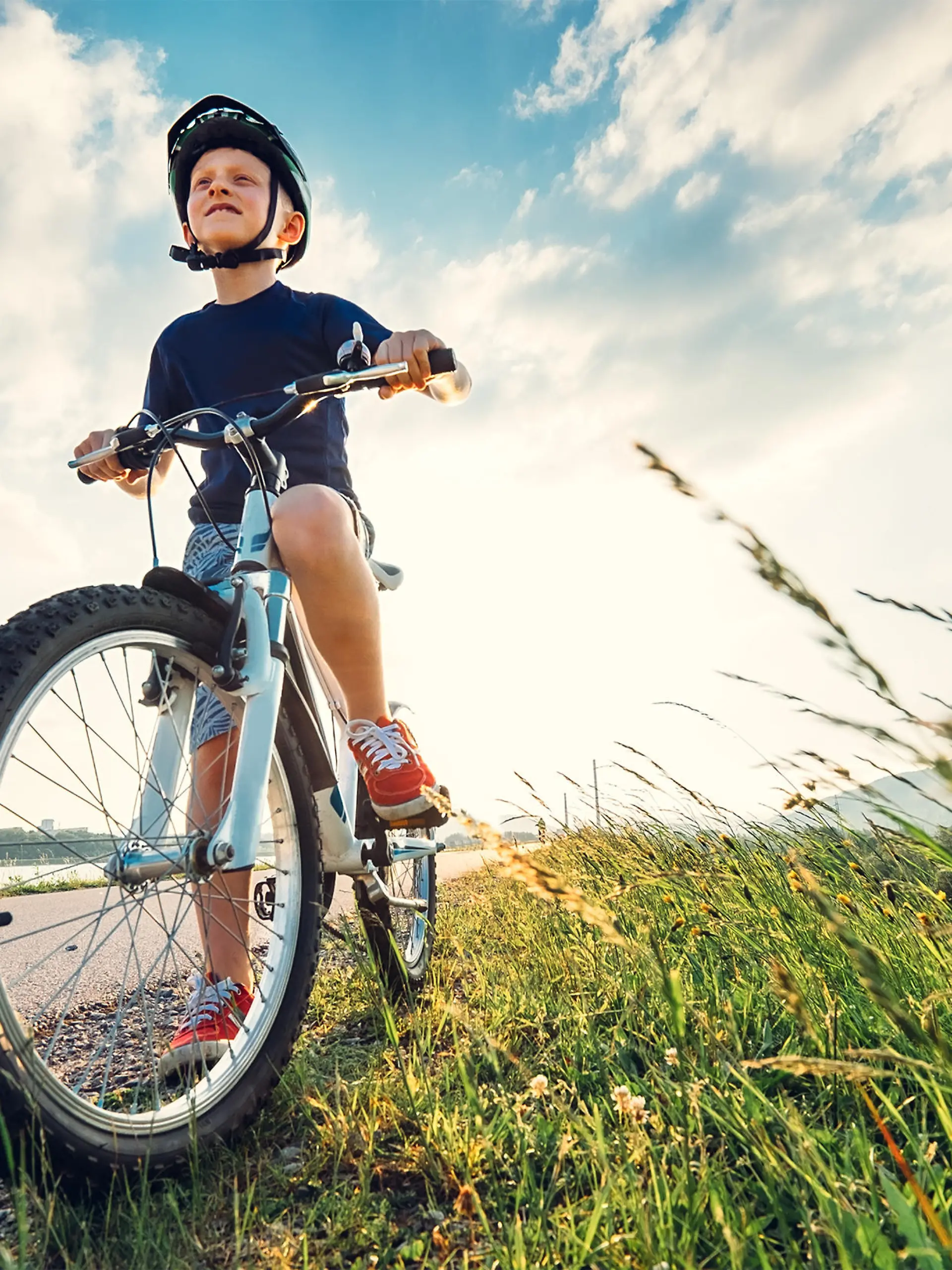 Boy start to ride a bicycle