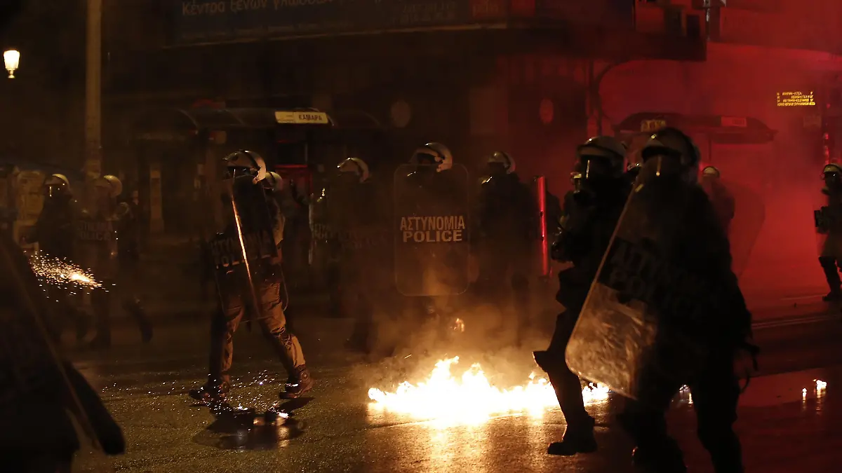 THESSALONIKI, GREECE - DECEMBER 06: Clashes erupt between police and demonstrators during a rally in Thessaloniki, Greece on December 6, 2021 to protest against police repression, marking the police killing of a teenager back in 2008. - The police killing of 15-year-old Alexandros Grigoropoulos sparked a month of rioting across Greece in 2008. Dimitris Kapantais / Anadolu Agency