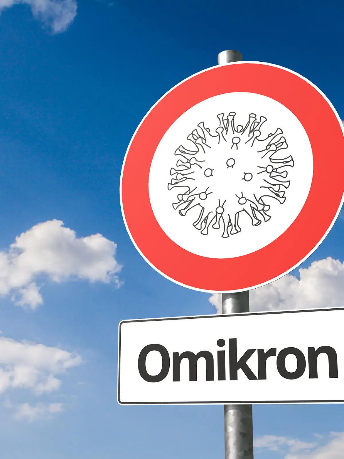 New mutation of corona virus named "omikron" B.1.1.529: Corona virus - Schematic image of a virus on a no entry sign with the the text "Omikron" below.