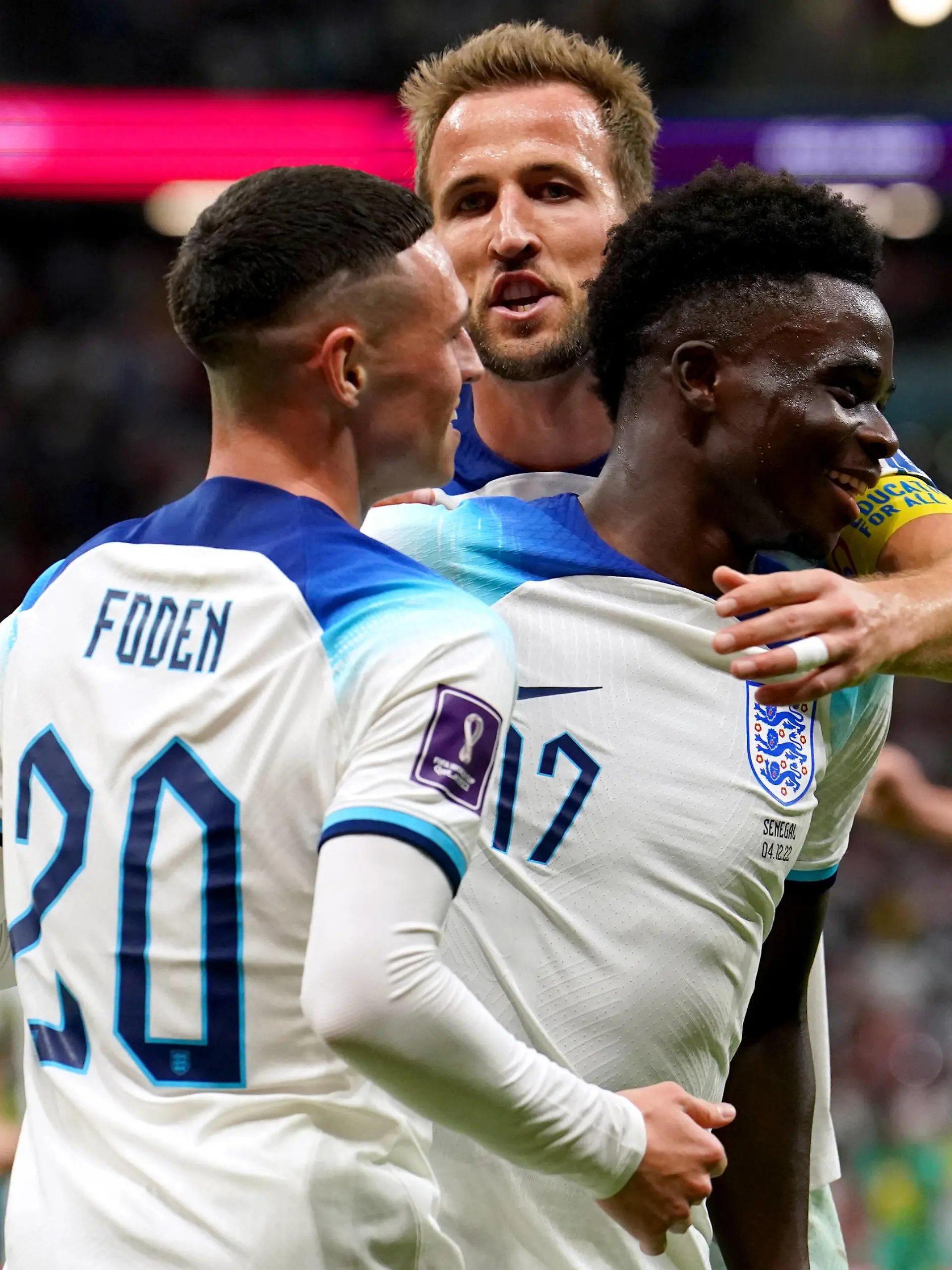 England v Senegal - FIFA World Cup, WM, Weltmeisterschaft, Fussball 2022 - Round of 16 - Al Bayt Stadium England s Bukayo Saka right celebrates with team-mates Phil Foden and Harry Kane after scoring their side s third goal of the game during the FIFA World Cup Round of Sixteen match at the Al-Bayt Stadium in Al Khor, Qatar. Picture date: Sunday December 4, 2022. Use subject to restrictions. Editorial use only, no commercial use without prior consent from rights holder. PUBLICATIONxNOTxINxUKxIRL Copyright: xMartinxRickettx 70109315