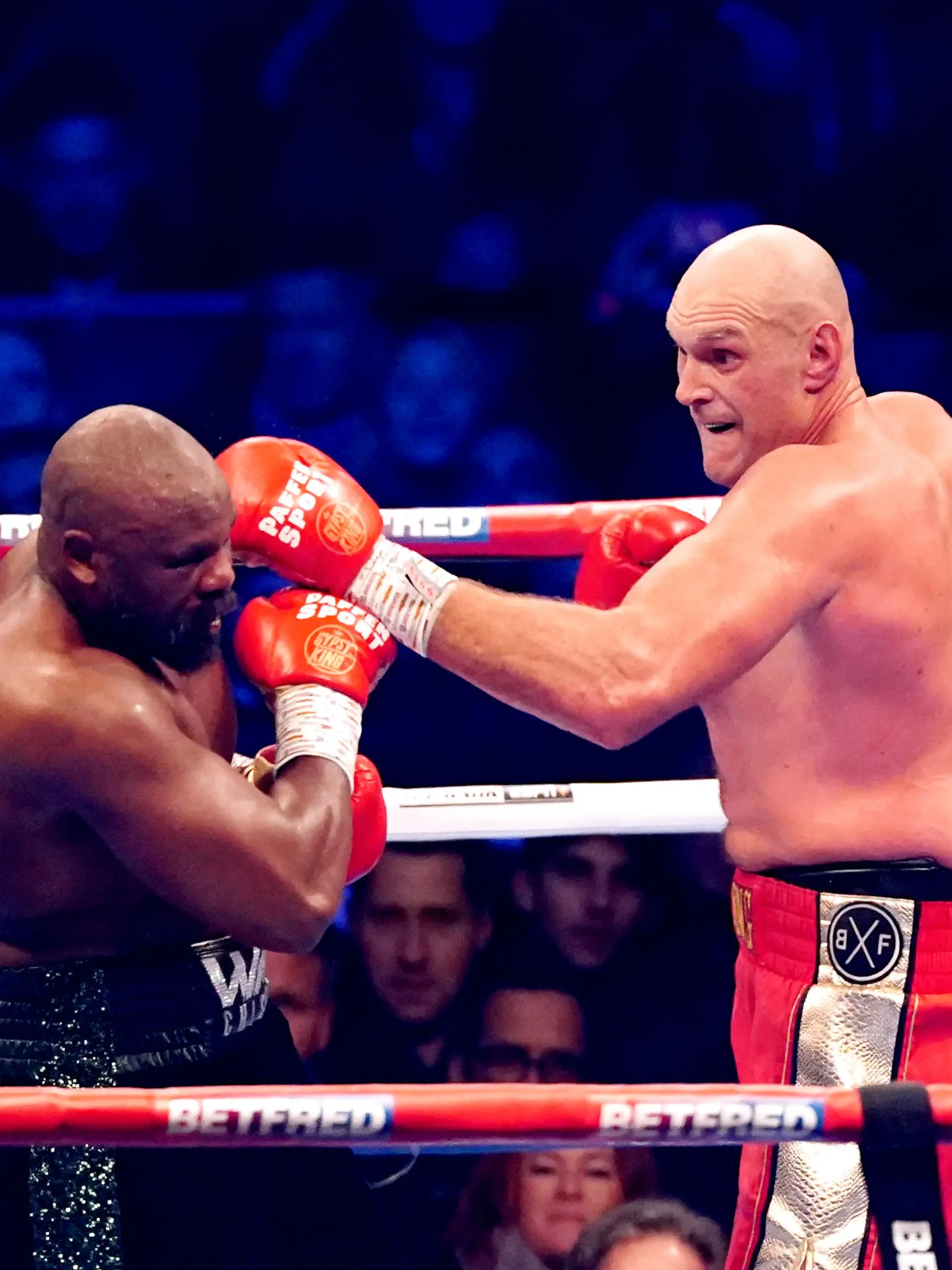 Tyson Fury v Derek Chisora III - Tottenham Hotspur Stadium. Tyson Fury (right) in action against Derek Chisora during their WBC World Heavyweight title fight at the Tottenham Hotspur Stadium, London. Picture date: Saturday December 3, 2022. See PA story BOXING London. Photo credit should read: Zac Goodwin/PA Wire. RESTRICTIONS: Use subject to restrictions. Editorial use only, no commercial use without prior consent from rights holder. URN:70095037