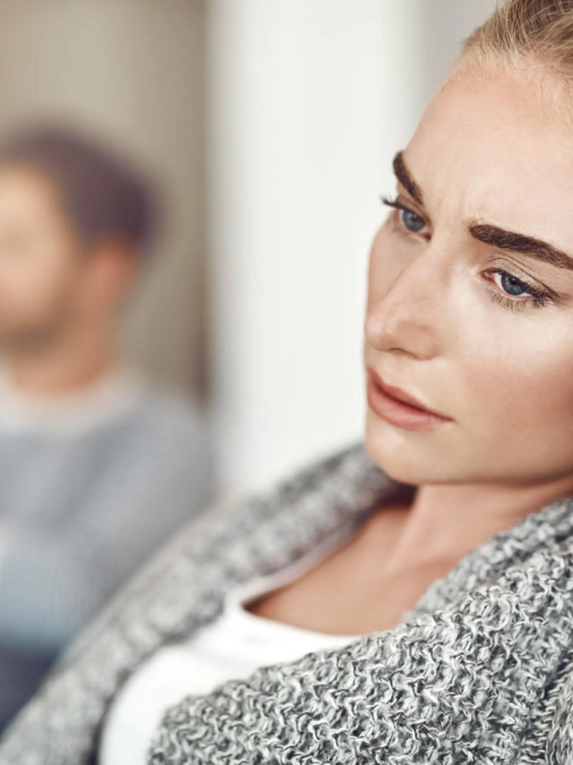 Cropped shot of an unhappy young couple after a fight at home