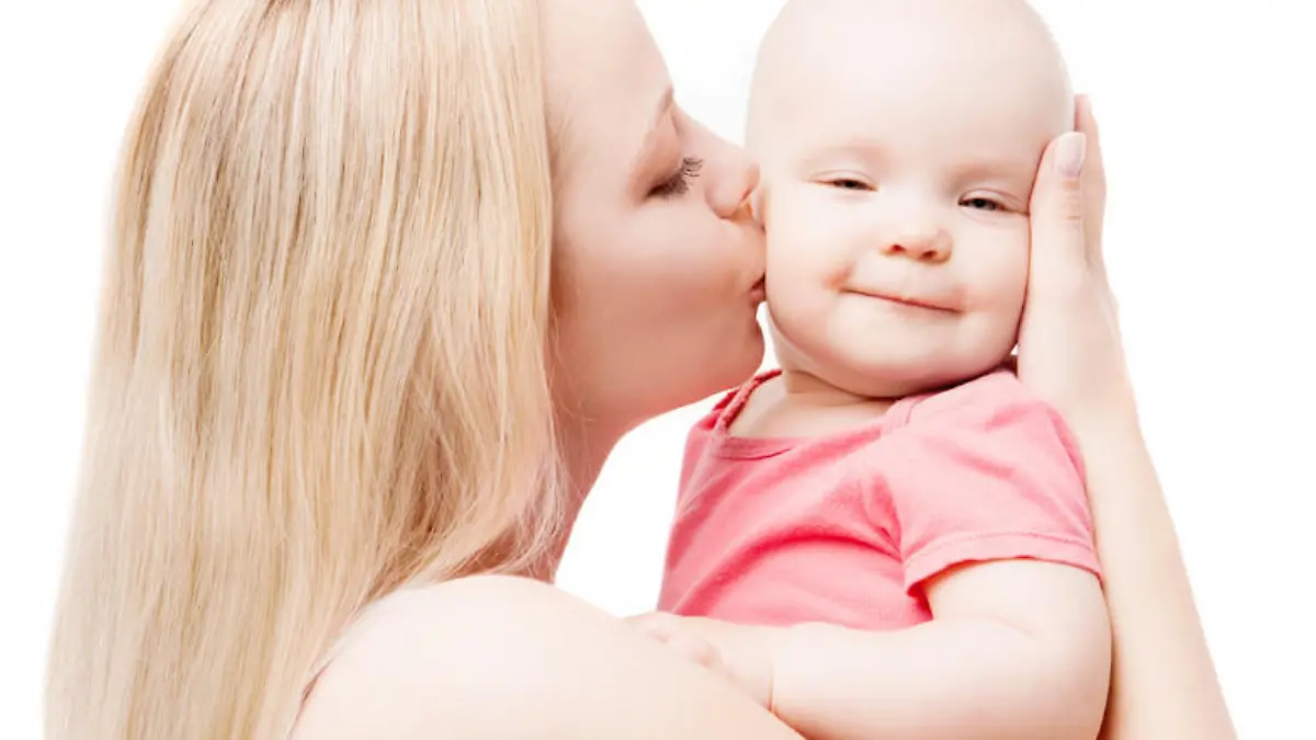 young mother kissing her baby, isolated on white background