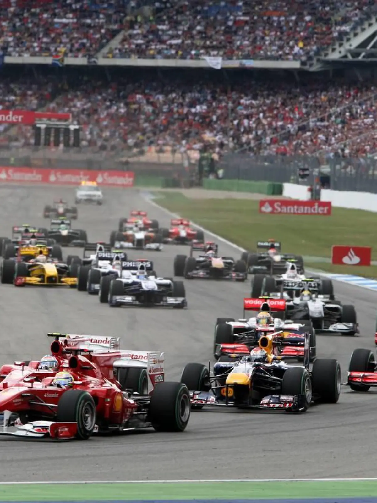 25.07.2010 Hockenheim, Germany, Felipe Massa (BRA), Scuderia Ferrari leads Fernando Alonso (ESP), Scuderia Ferrari and Sebastian Vettel (GER), Red Bull Racing at the start - Formula 1 World Championship, Rd 11, German Grand Prix, Sunday Race - www.xpb.cc, EMail: info@xpb.cc - copy of publication required for printed pictures. Every used picture is fee-liable. © Copyright: Davenport / xpb.cc