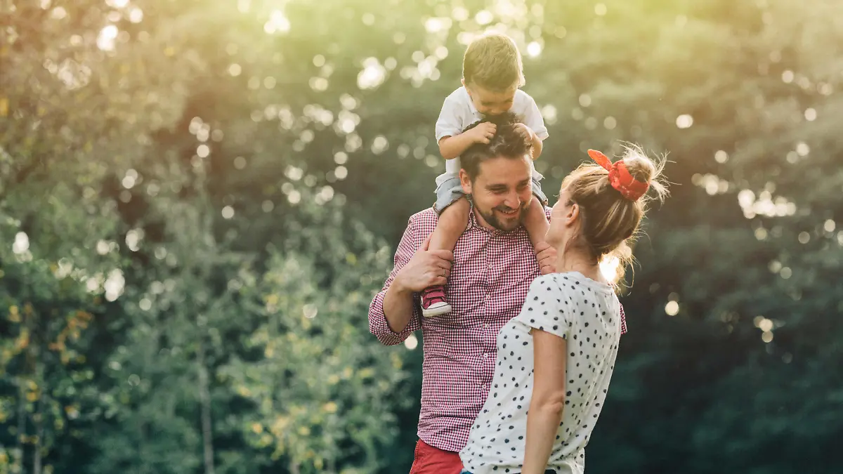 Happy young family having fun in the park.