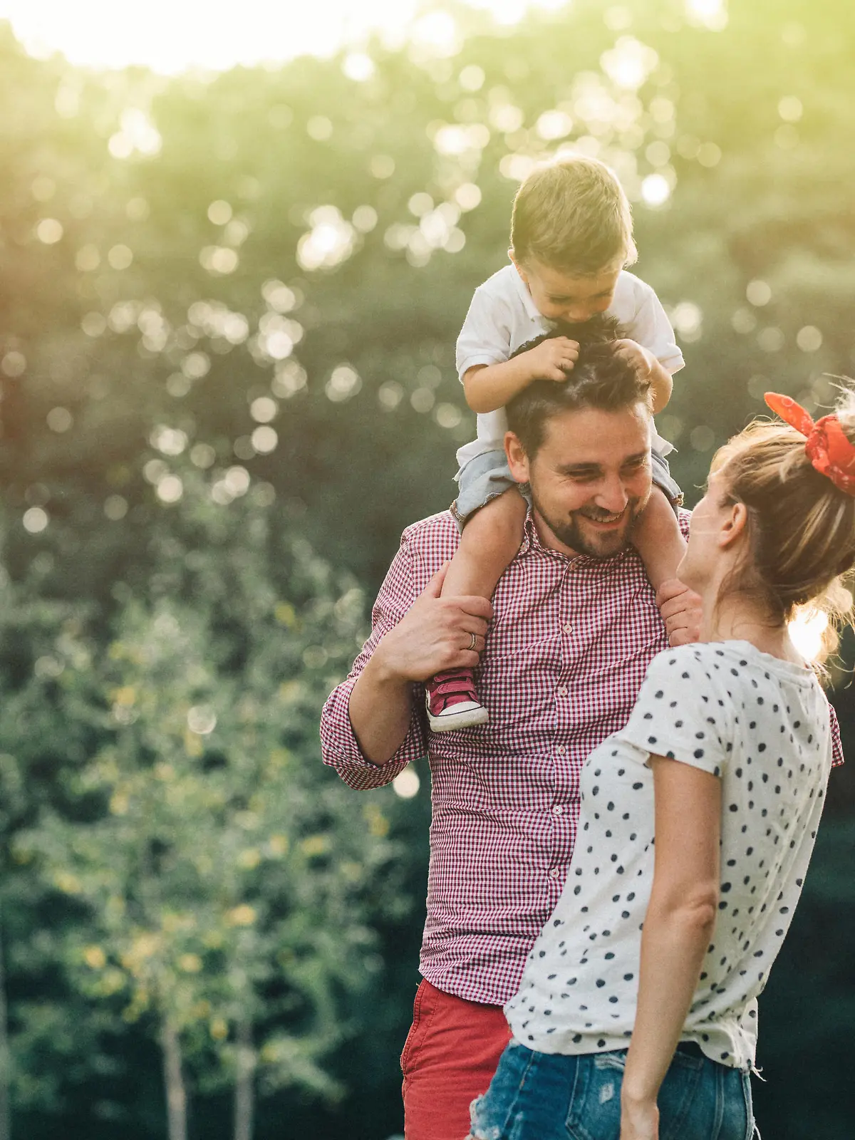 Happy young family having fun in the park.