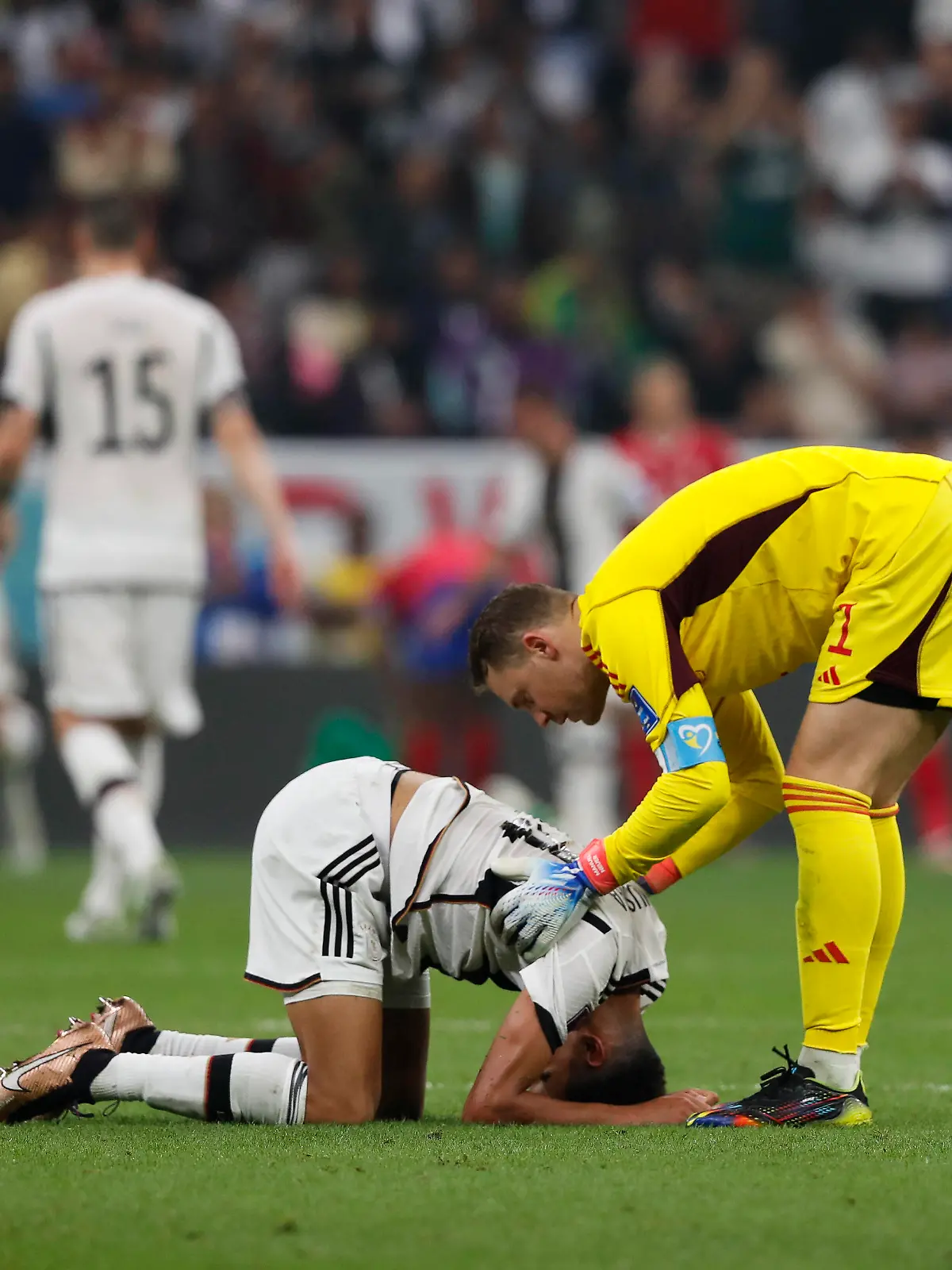  Costa Rica v Germany 2022 FIFA World Cup, WM, Weltmeisterschaft, Fussball Germany goalkeeper Manuel Neuer checks on team-mates Jamal Musiala during the 2022 FIFA World Cup Group E match at Al Bayt Stadium, Al Bayt PUBLICATIONxNOTxINxUKxCHN Copyright: xPaulxChestertonx FIL-17657-0166