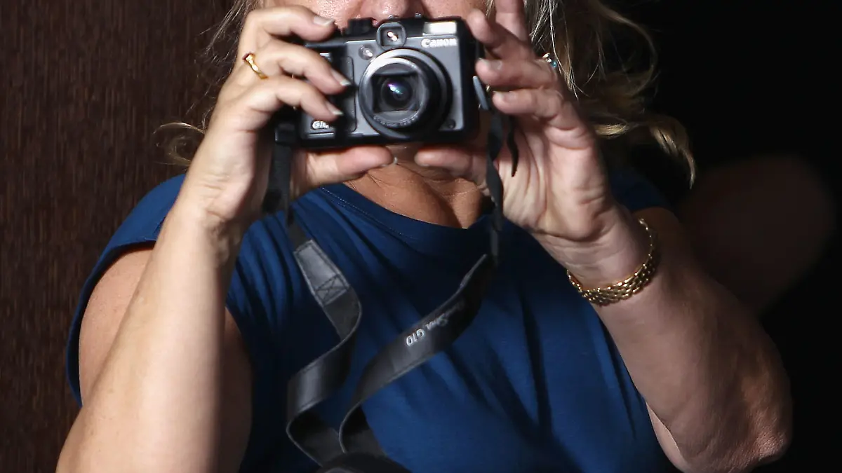 BERLIN - FEBRUARY 13:  Irmelin DiCaprio takes pictures of her son Leonardo during the 'Shutter Island' Photocall during day three of the 60th Berlin International Film Festival at the Grand Hyatt Hotel on February 13, 2010 in Berlin, Germany.  (Photo by Andreas Rentz/Getty Images)