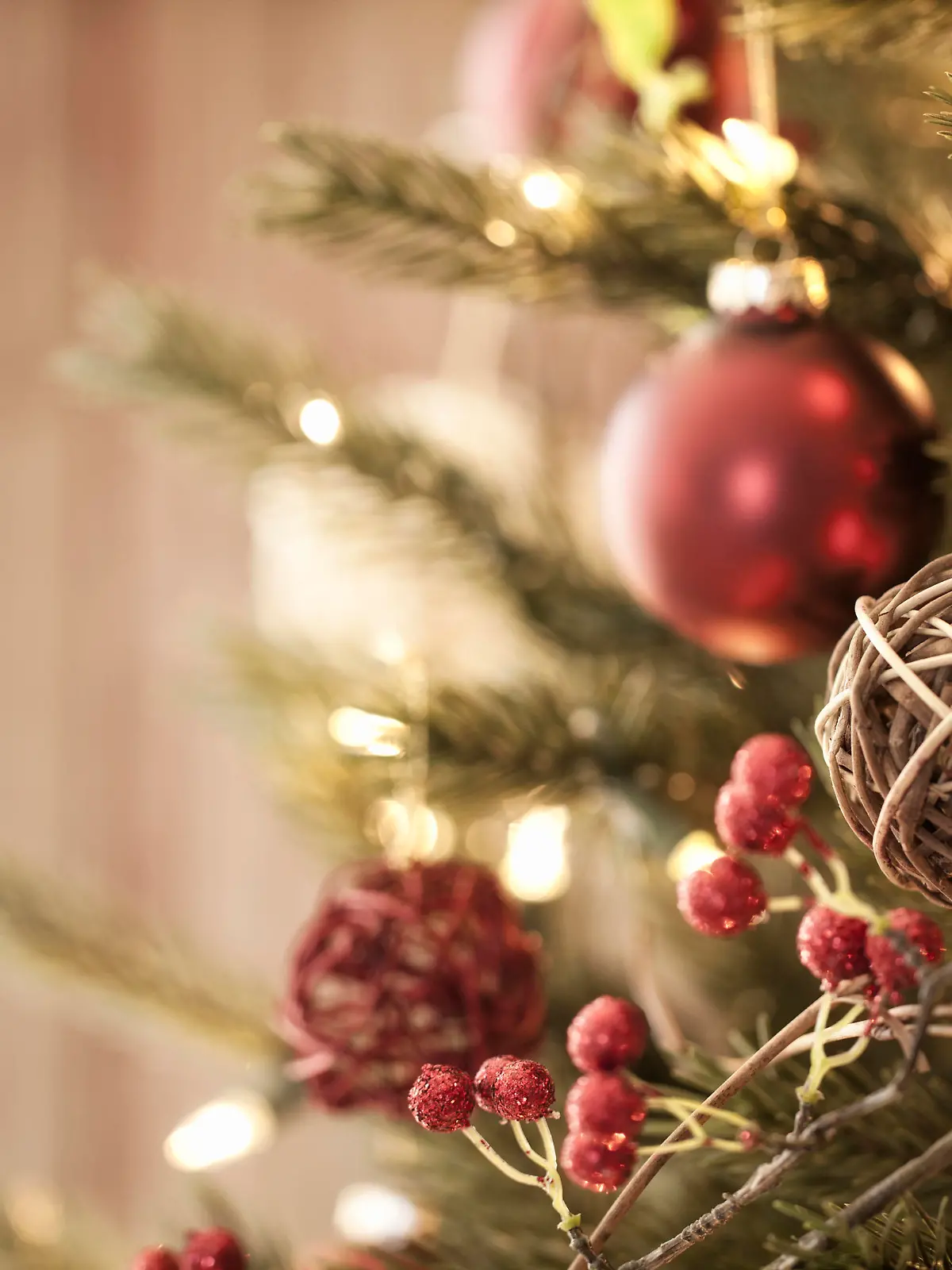 Christmas tree with eco friendly decorations, ornaments and gifts on an old wood background