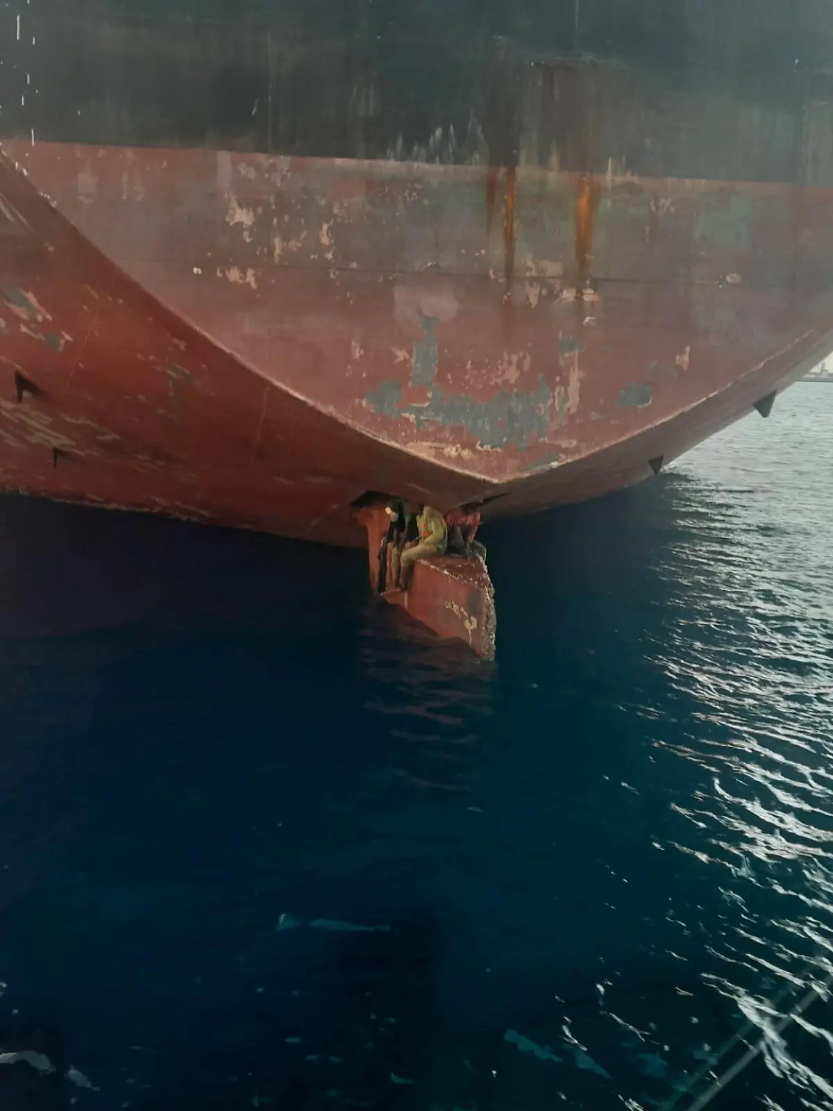 Three stowaways from Nigeria were rescued in the Canary Islands by the Spanish coastguard on Monday 28November2022 after riding on the rudder of an oil tanker on an 11-day voyage from Nigeria. Coastguard photos show the men sitting on the rudder, with their feet dangling just above the water. The stowaways were taken to hospital at the tanker s destination in Gran Canaria and treated for dehydration. The Althini II, which sails under the flag of Malta, arrived in Las Palmas, Gran Canaria, following a 2,700 nautical mile journey from Lagos. The men arent the first to make the unusual and dangerous trip. In 2020 a 14 year-old boy who made the same journey over 15 days told the newspaper El Pais that he spent the entire 15 day jou PUBLICATIONxNOTxINxUKxFRA Copyright: xx 52230717 