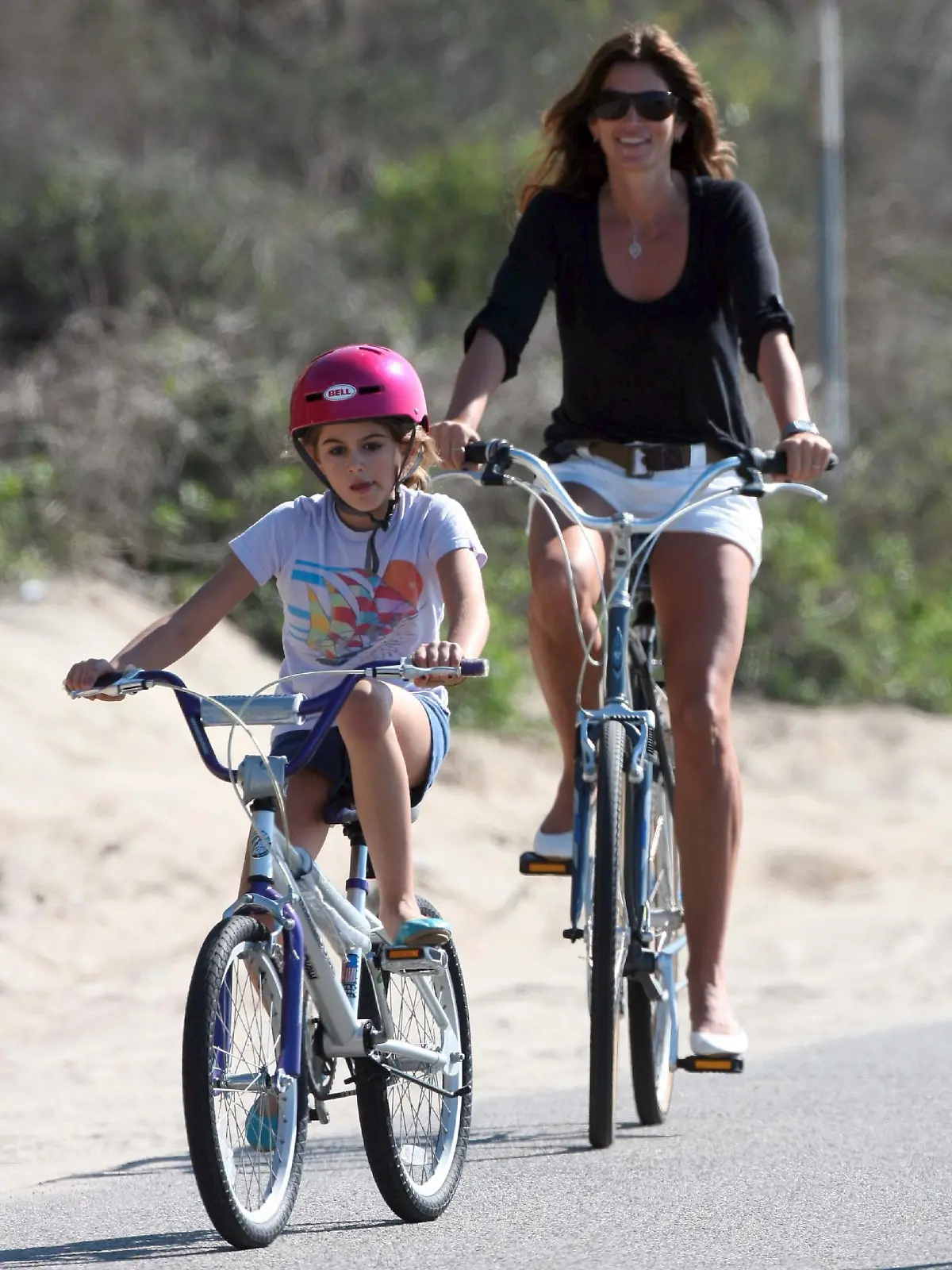 Cindy Crawford and Kaia GerberCindy Crawford on a family bicycle ride in MalibuLos Angeles, California - 14.11.09Mandatory Credit: WENN.com* MAN CHARGED OVER CRAWFORD AND GERBER EXTORTION PLOTCops in the U.S. have launched an international manhunt after charging a suspect over an attempt to extort $100,000 (£62,500) from CINDY CRAWFORD and her husband RANDE GERBER.  Gerber paid Edis Kayalar, the acquaintance of a former nanny, $1,000 (£625) to keep a controversial snap of their young daughter bound to a chair in revealing clothing away from the media and internet.  But Kayalar threatened to sell the picture to the press for $500,000 (£312,500) before he was deported to his native Germany in September (09).  He continued his threats to sell the picture earlier this month (Nov09), and demanded $100,000 from the couple to keep it private - prompting the model and her husband to call in the FBI.  Kayalar was charged with extortion on Thursday night (12Nov09) and authorities are now searching for him in Germany, according to the New York Daily News.  The model's representatives insist the controversial photo at the centre of the extortion plot was taken by the nanny during a game of cops and robbers, without Crawford's knowledge. (CL/WNWCDN/ZN)