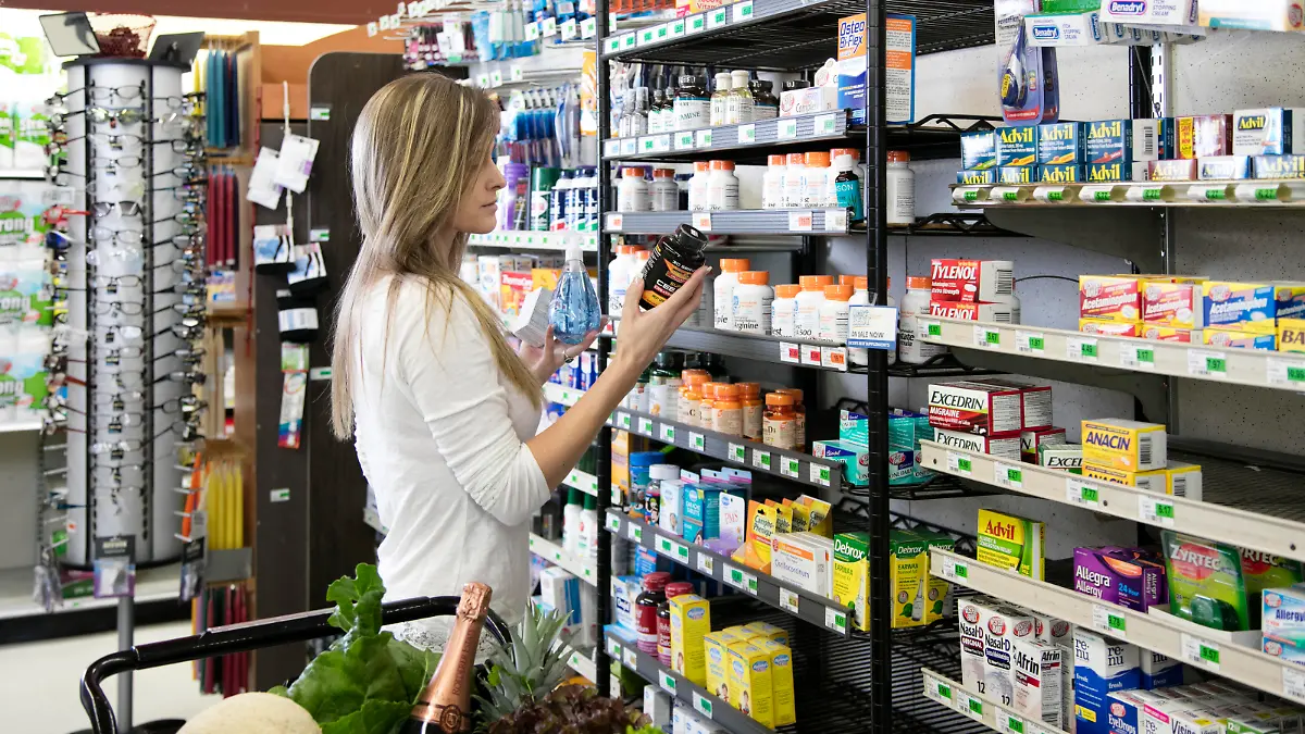 Woman shopping in store buying health and beauty supplies