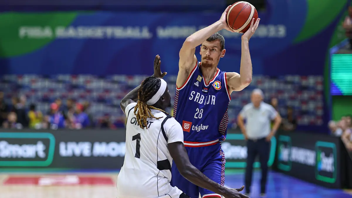 MANILA, PHILIPPINES - AUGUST 30: Borisa Simanic 28 of Serbia drives the ball against Nuni Omot 1 of South Sudan during the first round Group B match between South Sudan and Serbia on day 6 of the FIBA Basketball World Cup at Araneta Coliseum on August 30, 2023 in Manila, Philippines. PUBLICATIONxNOTxINxCHN Copyright: xVCGx 111451745104
