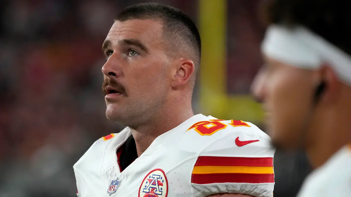 Kansas City Chiefs tight end Travis Kelce watches from the sidelines during the first half of an NFL preseason football game against the Arizona Cardinals, Saturday, Aug. 19, 2023, in Glendale, Ariz. (AP Photo/Rick Scuteri)