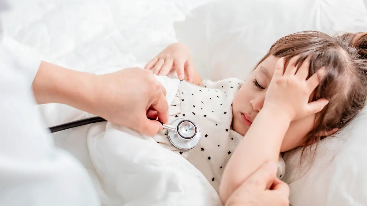doctor exams little girl with stethoscope
