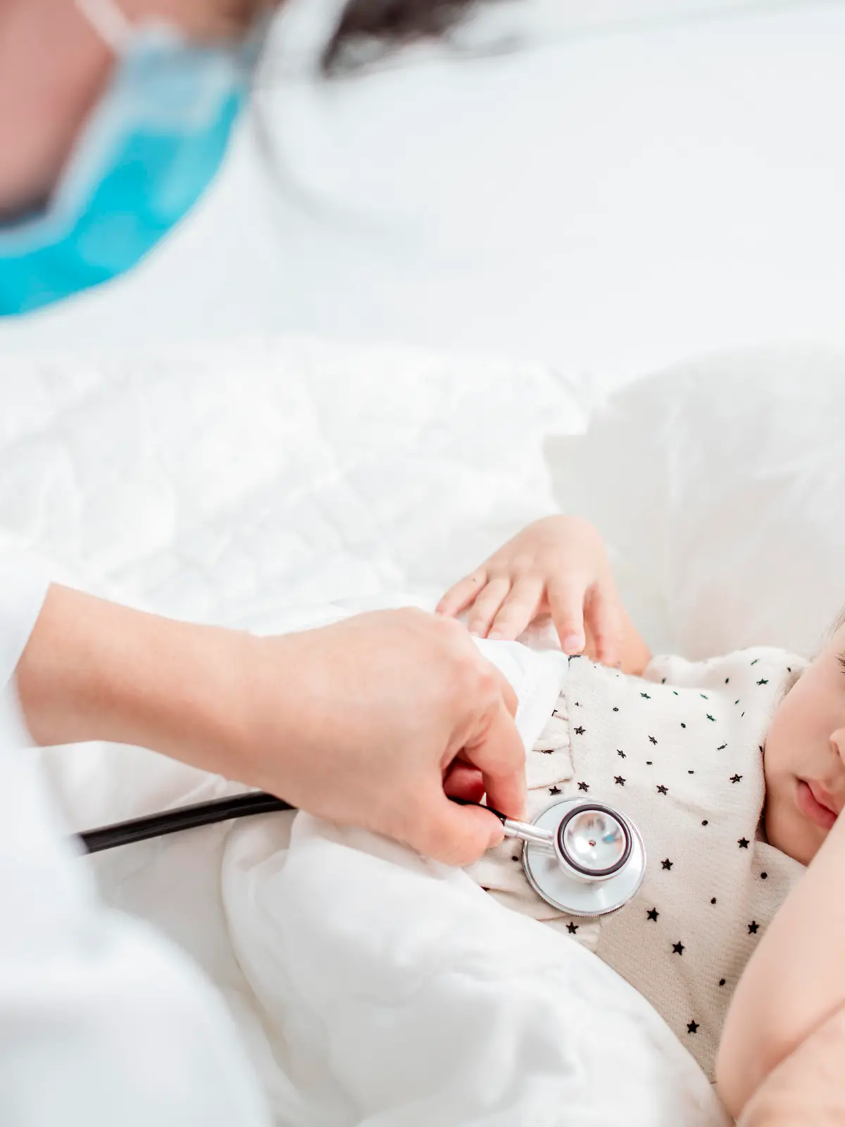 doctor exams little girl with stethoscope