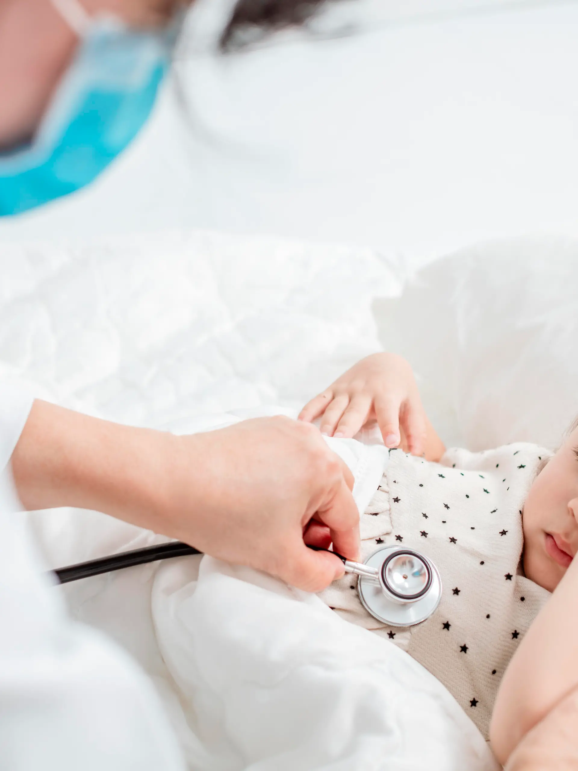 doctor exams little girl with stethoscope