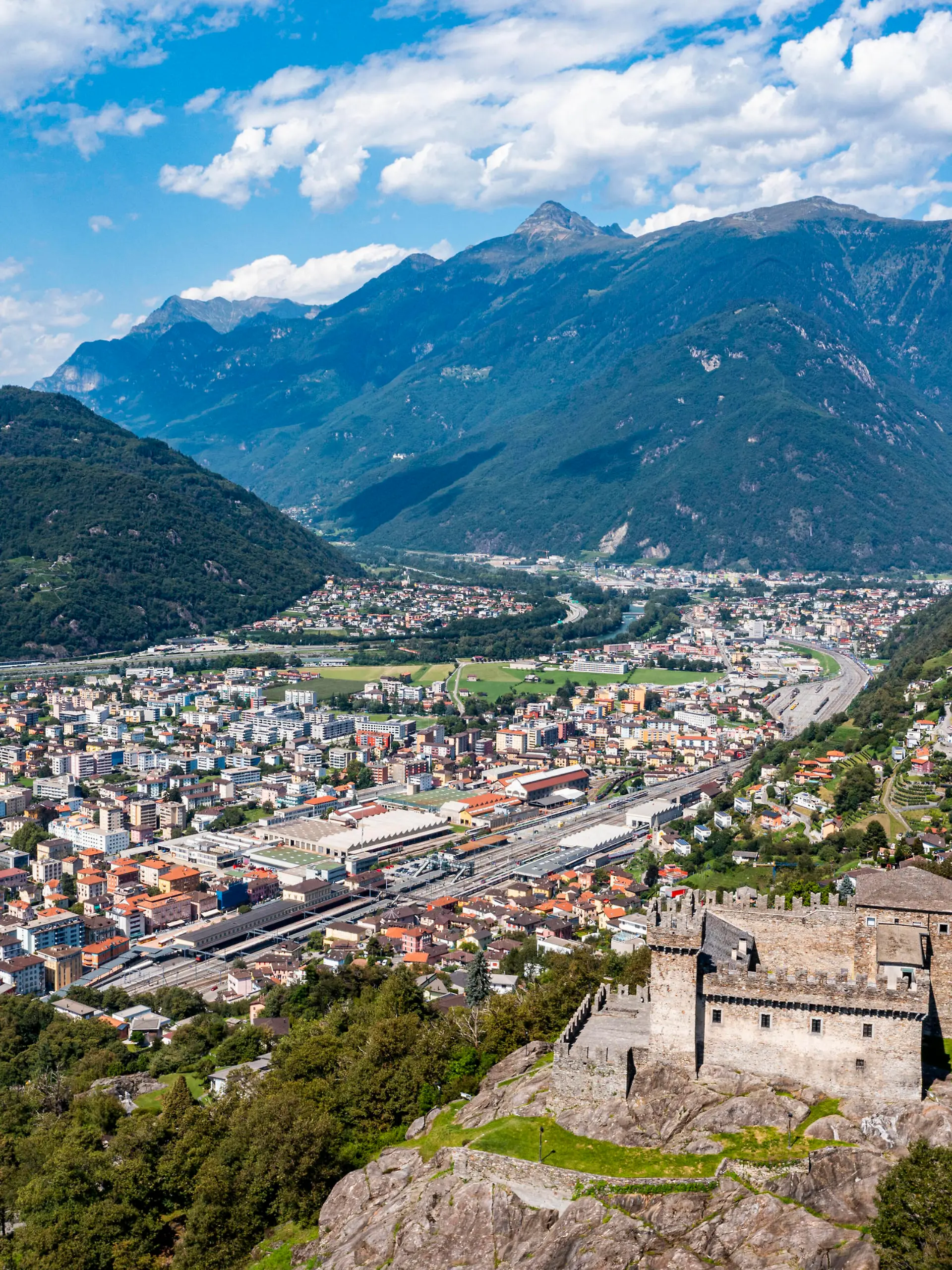 Switzerland, Ticino, Bellinzona, Aerial view of Sasso Corbaro castle overlooking town below RUNF04669 