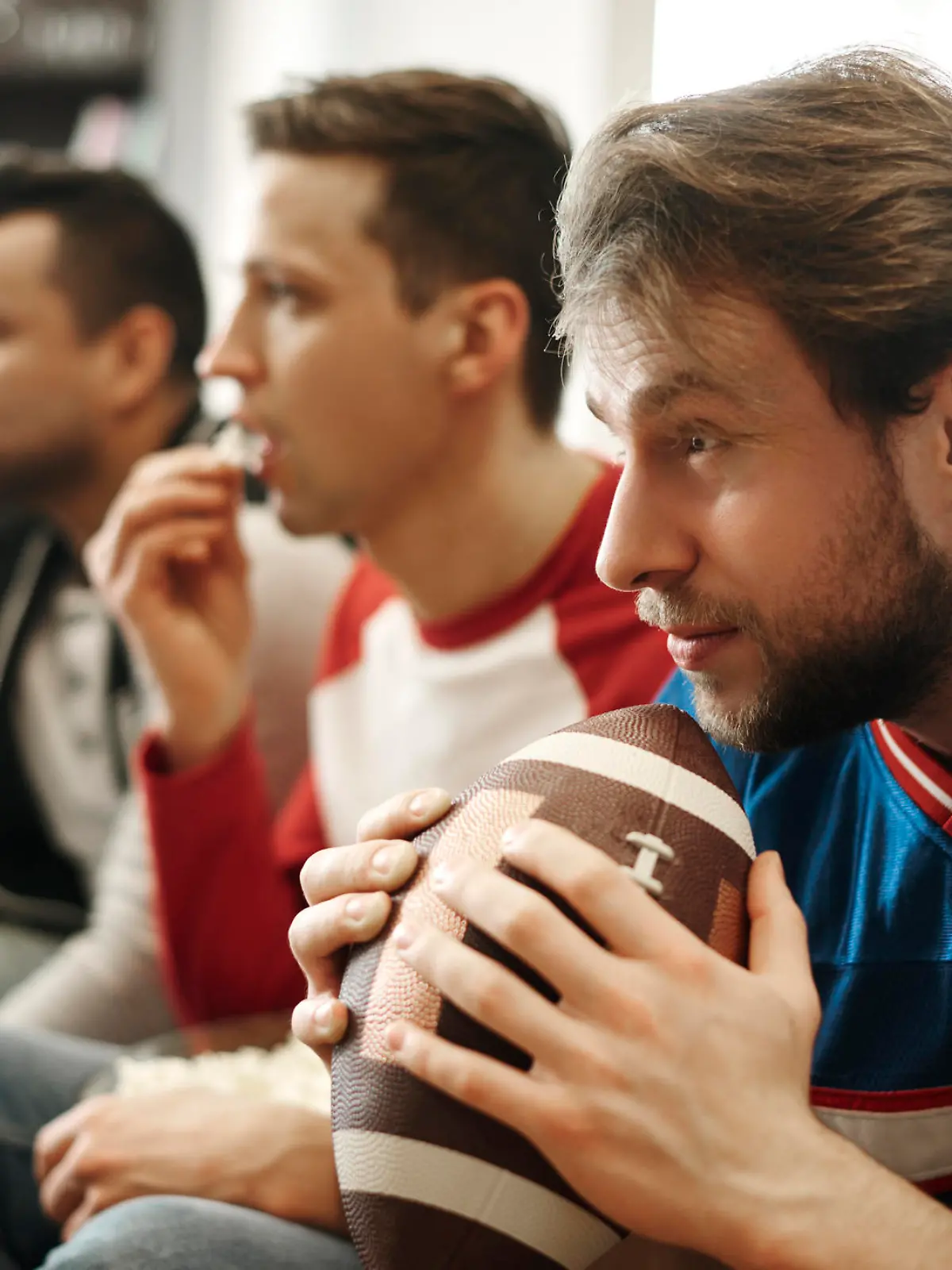 Focused watching football game at home