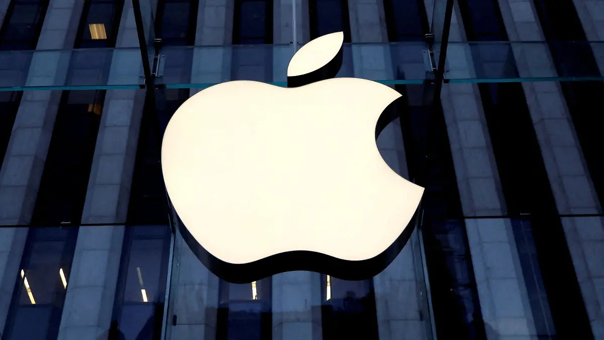 FILE PHOTO: The Apple Inc. logo is seen hanging at the entrance to the Apple store on 5th Avenue in Manhattan, New York, U.S., October 16, 2019. REUTERS/Mike Segar/File Photo